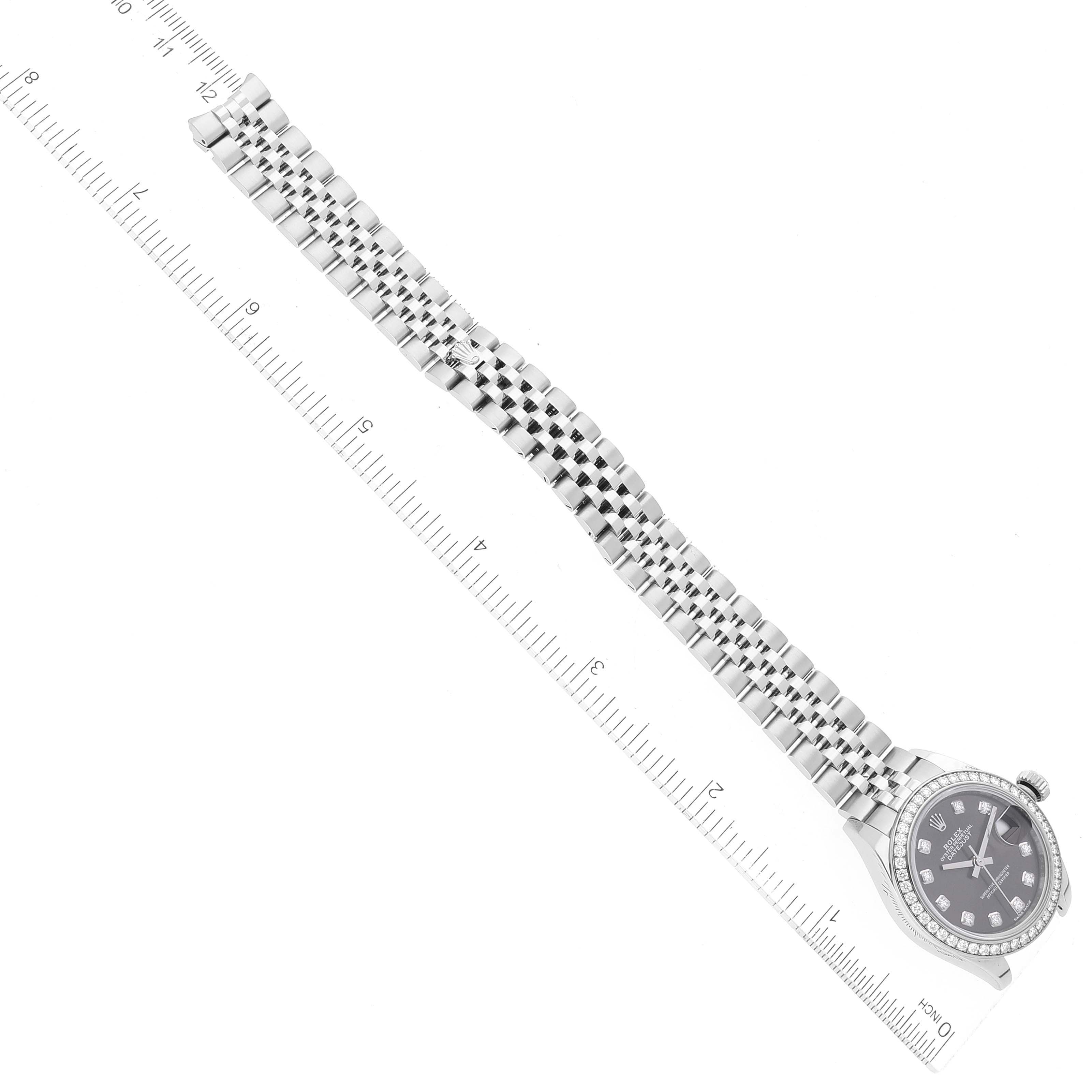 The image shows a Rolex Datejust 279384 Women's Stainless Steel Grey Dial 279384 Women's Stainless Steel Grey Dial watch in a side profile with its full bracelet laid flat against a measurement ruler.