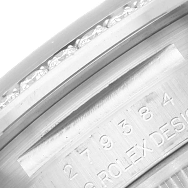 This image shows a close-up of the engraved model number and part of the bezel of a Rolex Datejust 279384 Women's Stainless Steel Grey Dial 279384 Women's Stainless Steel Grey Dial watch.