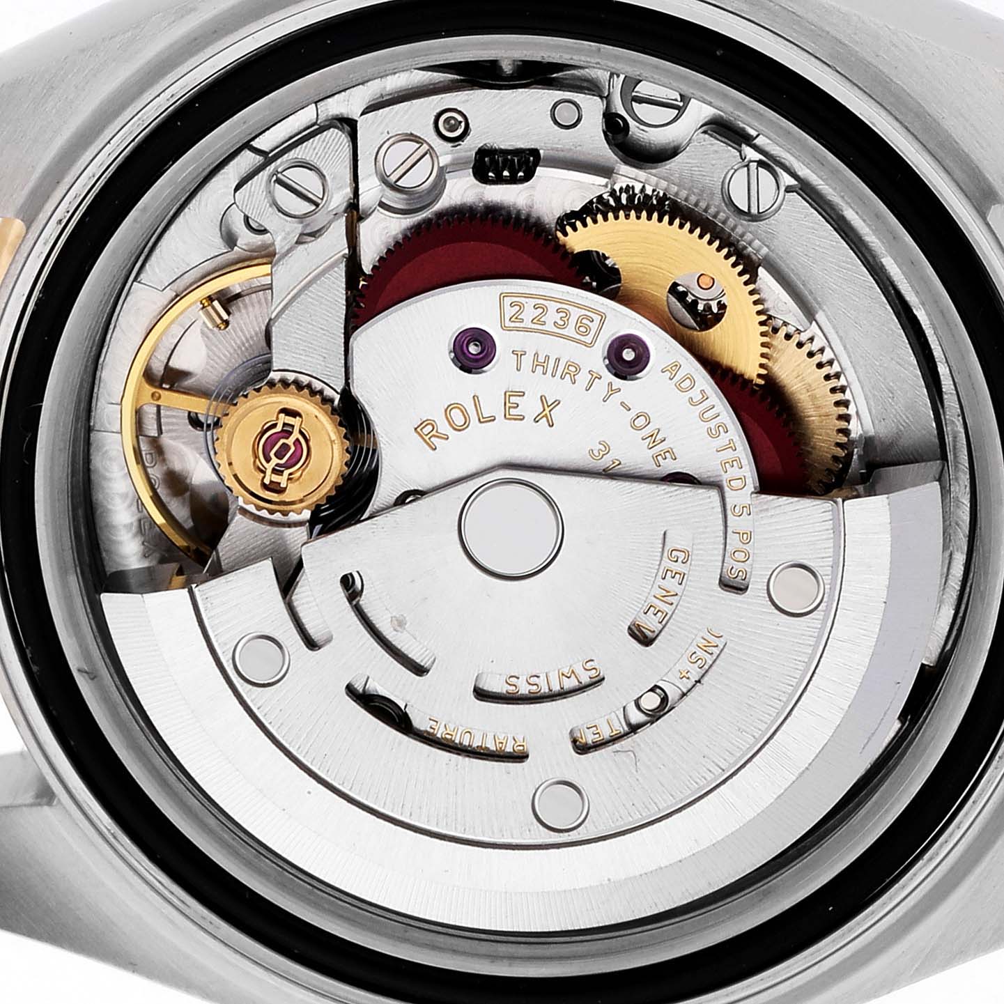 The image shows a close-up view of the Rolex Datejust 279383 Women's Steel and Gold (two tone) Mother of Pearl Dial movement, highlighting gears and intricate components.