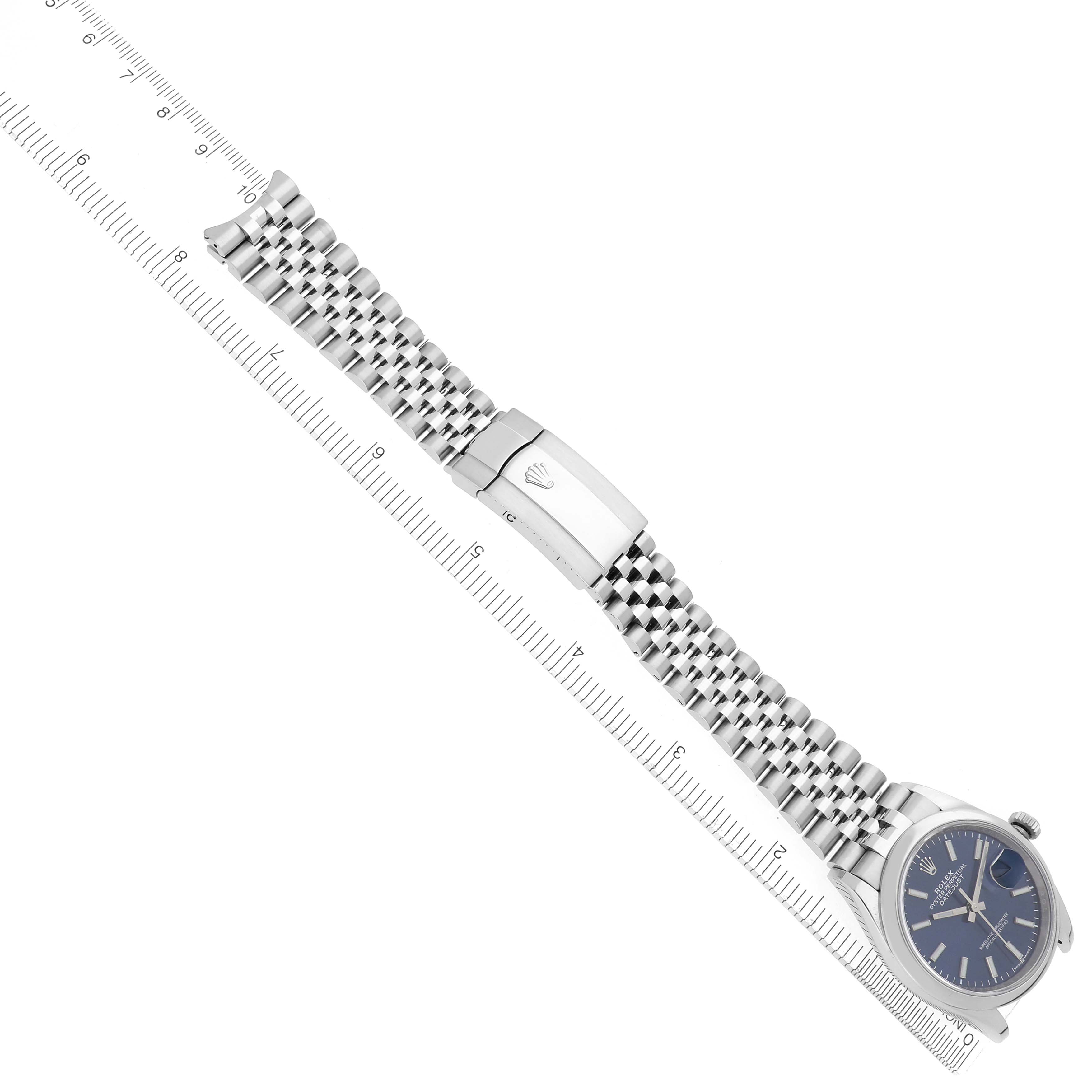 The Rolex Datejust 126200 Men
s Stainless Steel Blue Dial 126200 Men
s Stainless Steel Blue Dial watch is shown from an angled top view, highlighting the bracelet and clasp details.