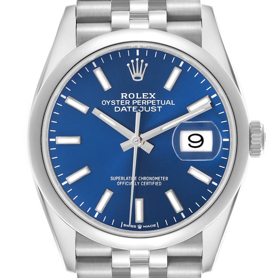 The image shows a front view of a Rolex Datejust watch, highlighting the blue dial, date window, and stainless steel bracelet.