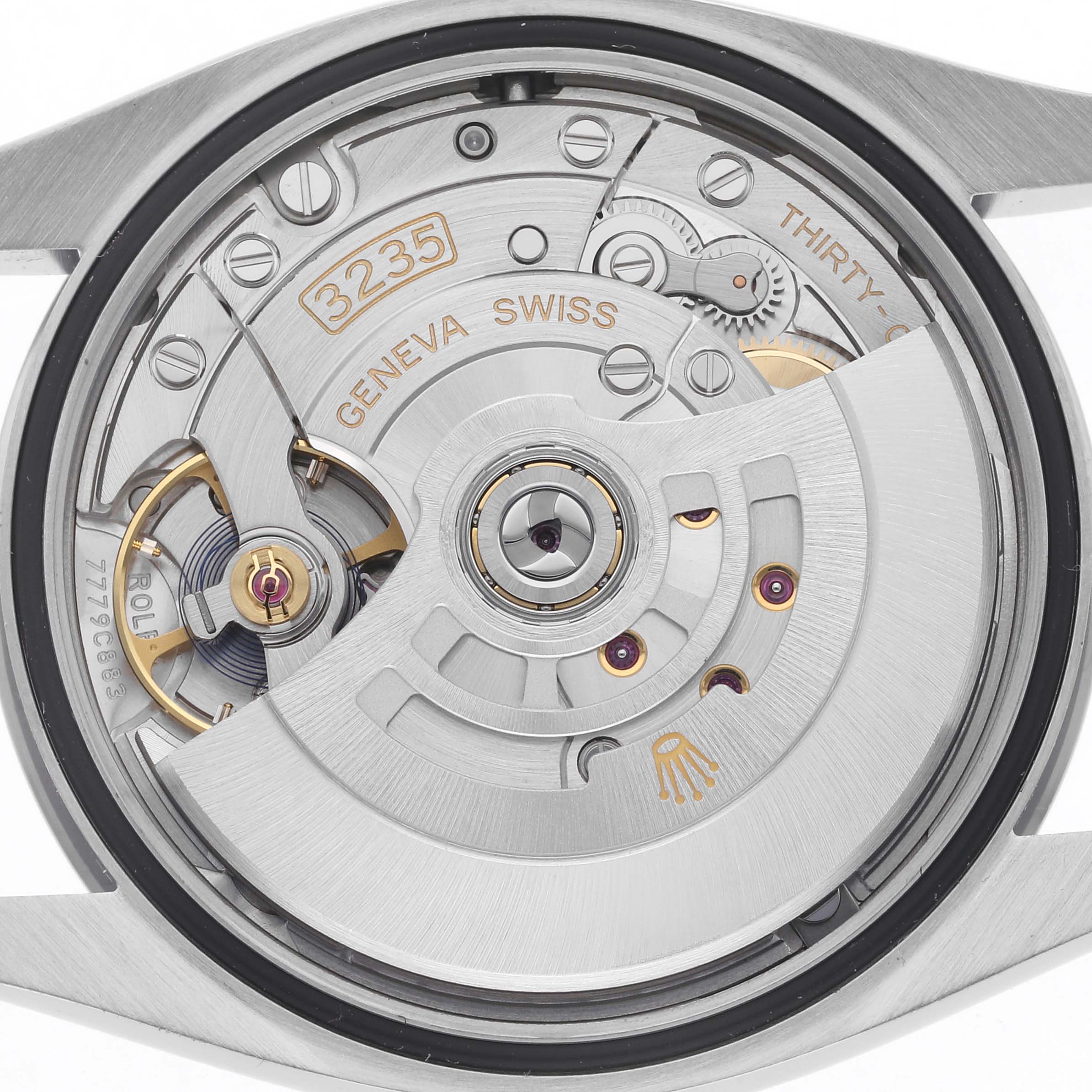 The image shows the movement of a Rolex Datejust 126200 Men
s Stainless Steel Blue Dial 126200 Men
s Stainless Steel Blue Dial watch, viewed from the back, featuring its intricate mechanical parts.