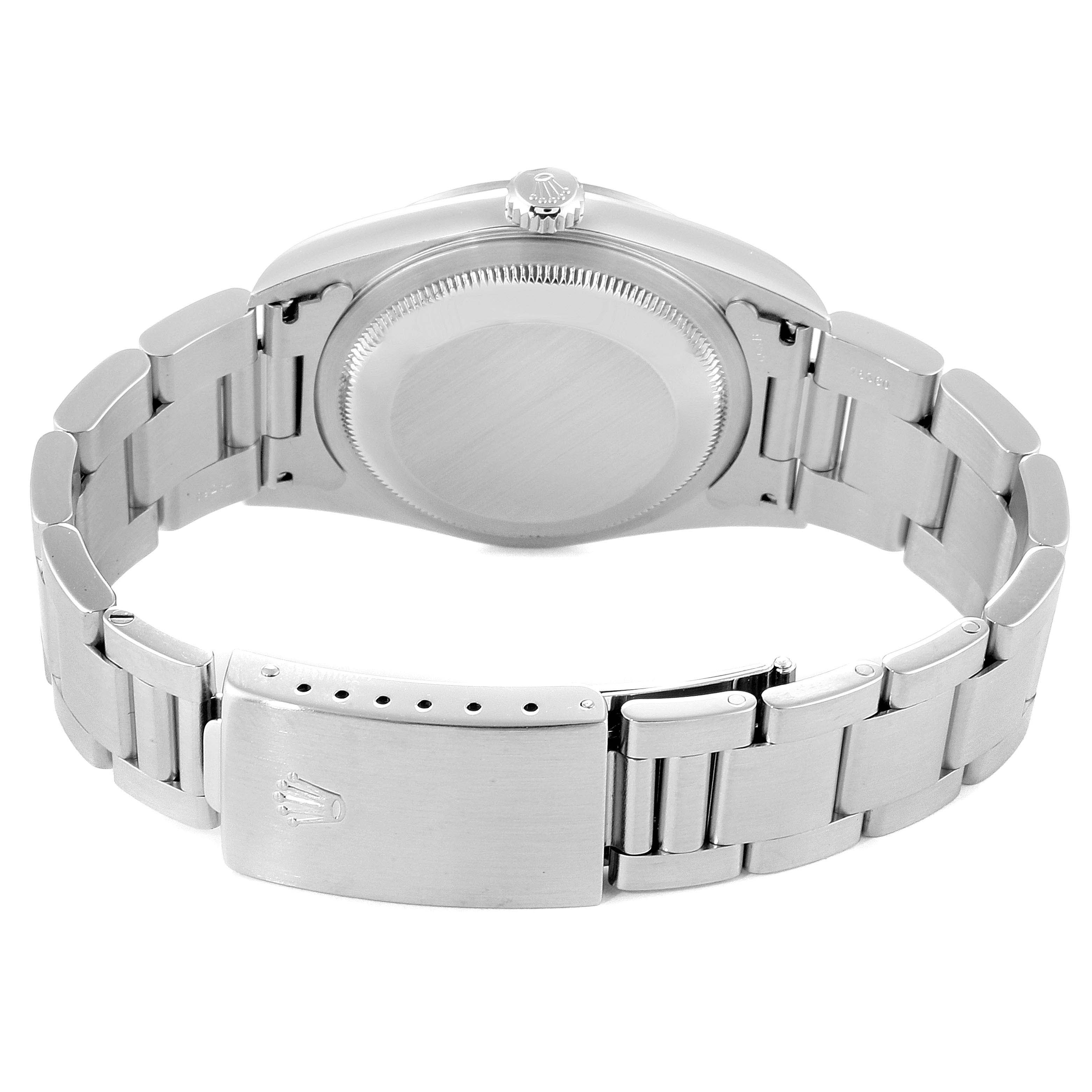 The image shows a rear view of the Rolex Datejust 16200 Men
s Stainless Steel Grey Dial 16200 Men
s Stainless Steel Grey Dial, focusing on its stainless steel case back and bracelet with a clasp.