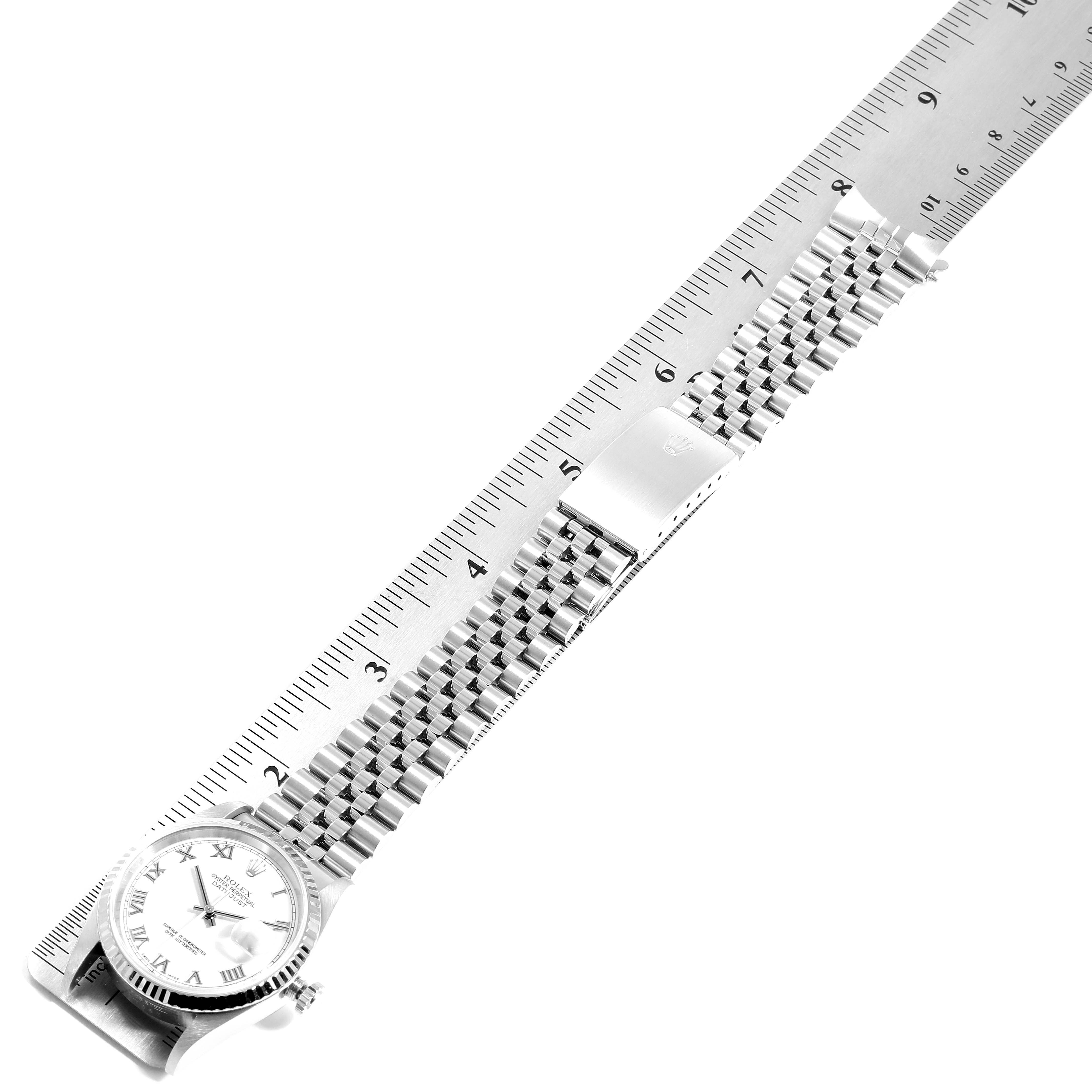 The image shows a Rolex Datejust 16234 Men's Stainless Steel White Dial 16234 Men's Stainless Steel White Dial watch laid flat next to a ruler, displaying the watch face and bracelet.