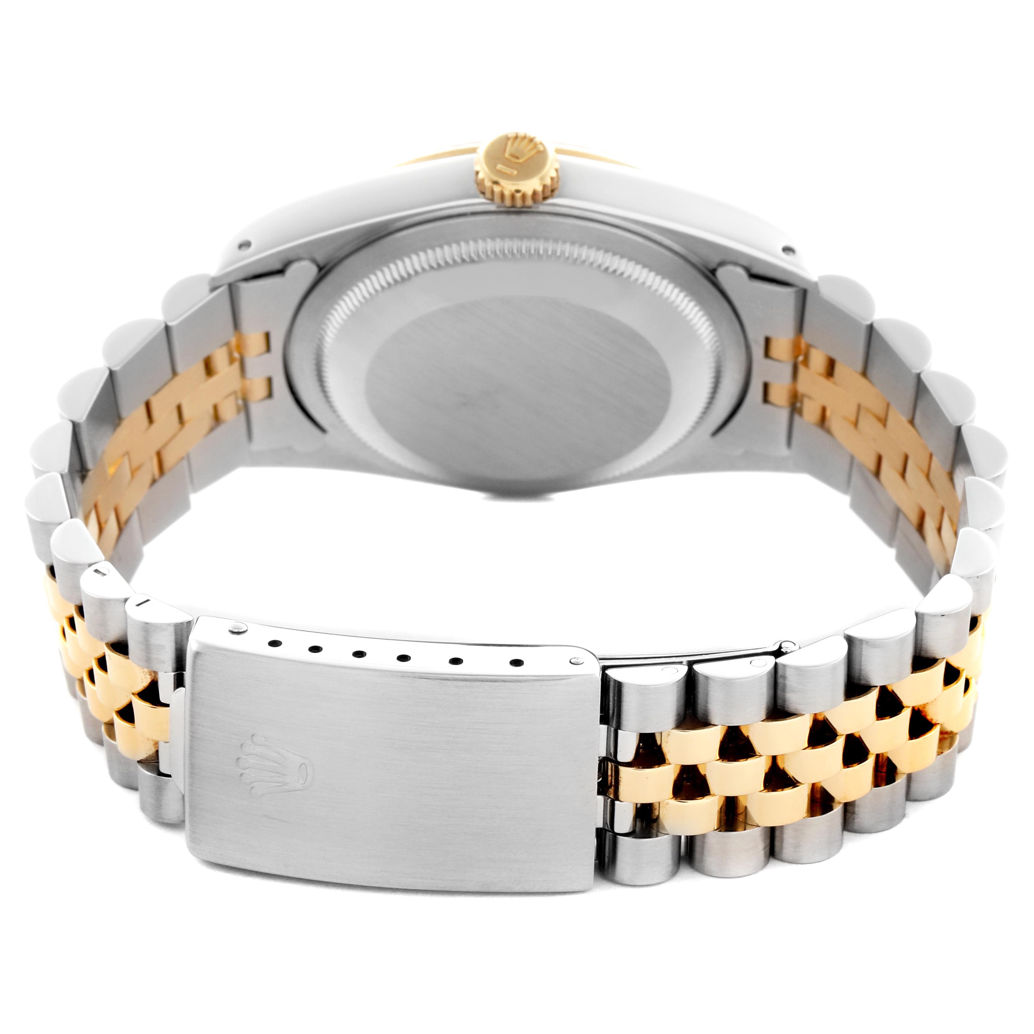 The image shows the back of a Rolex Datejust 16233 Men
s Steel and Gold (two tone) Champagne Dial 16233 Men
s Steel and Gold (two tone) Champagne Dial, focusing on the case back, two-tone bracelet, and clasp.