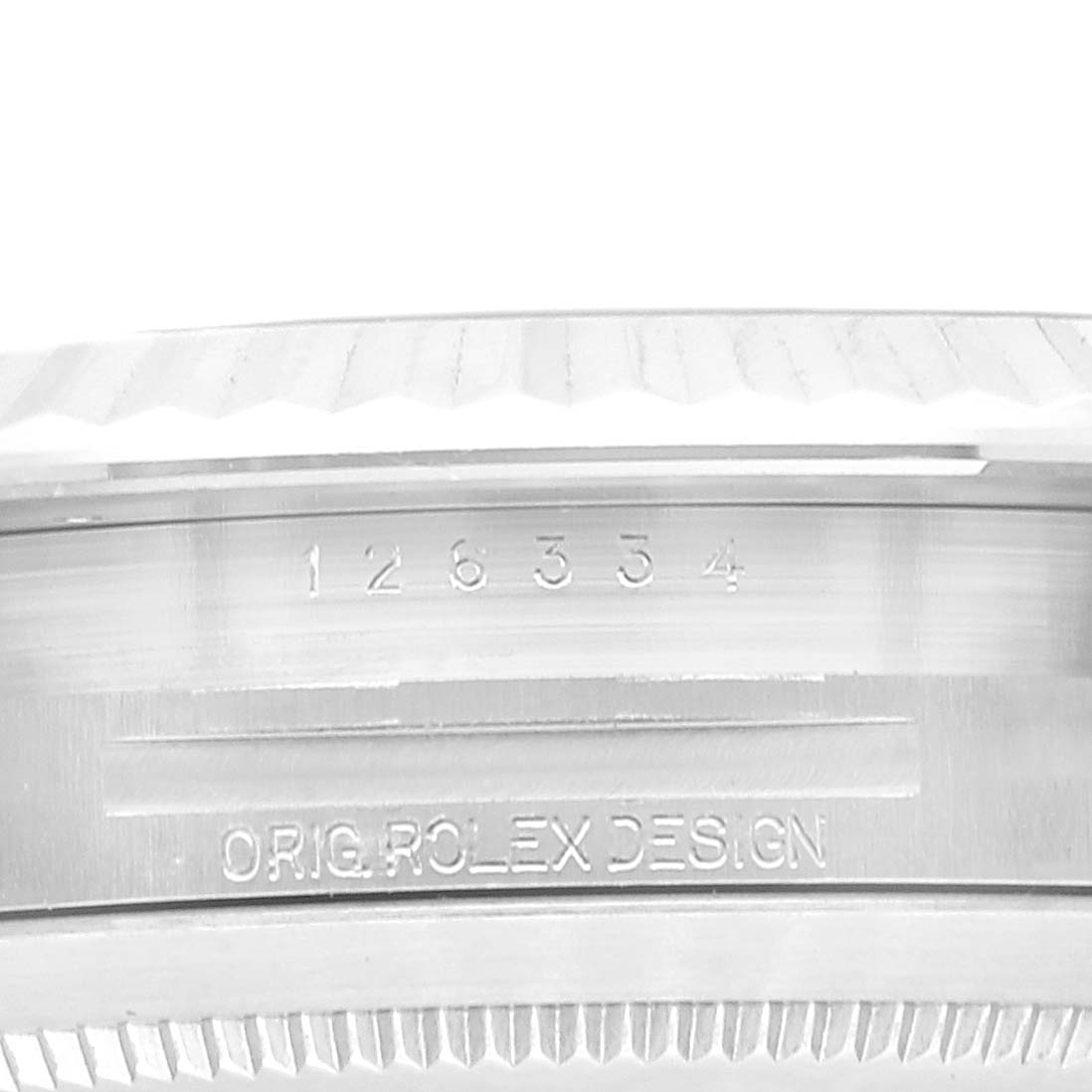 This image shows a close-up of the side of the Rolex Datejust 41 126334 Men's Stainless Steel Blue Dial 126334 Men's Stainless Steel Blue Dial watch case, highlighting its serial number and "ORIG. ROLEX DESIGN" engraving.