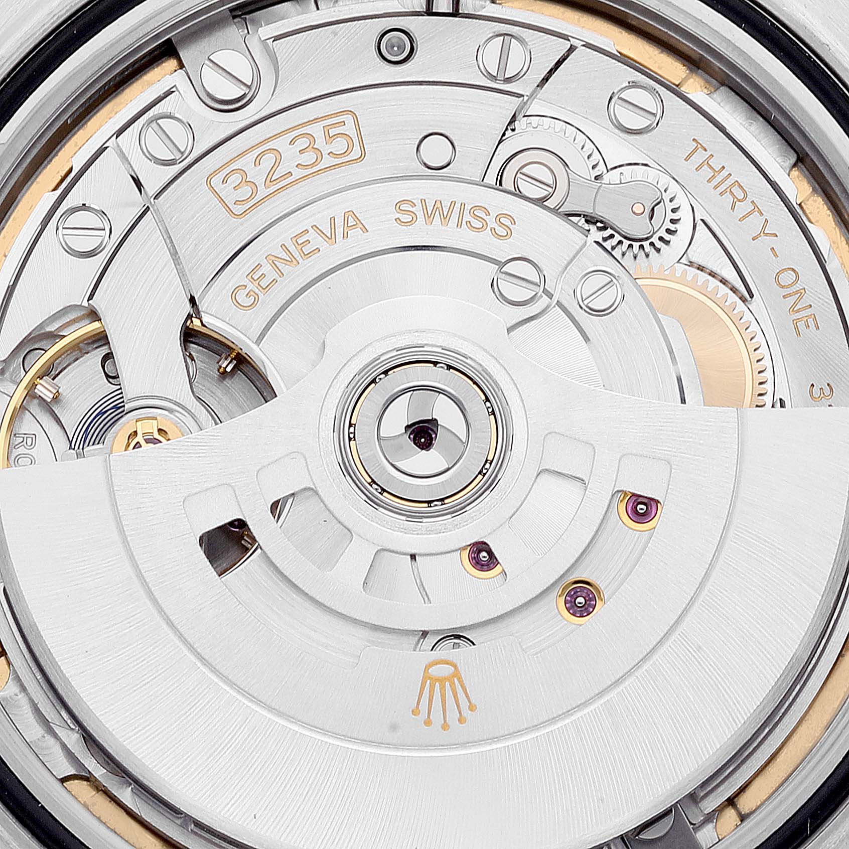 This is a close-up view of the Rolex Datejust 41 126333 Men's Steel and Gold (two tone) White Dial 126333 Men's Steel and Gold (two tone) White Dial's movement, featuring the intricate mechanics and engraved details.