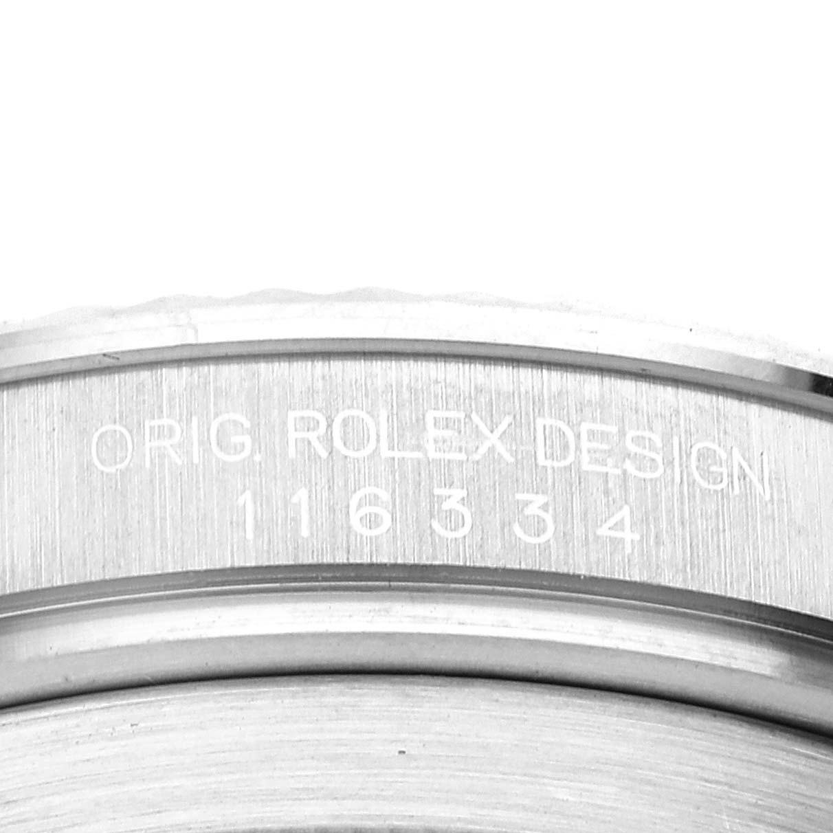 The image shows a close-up of the inner bezel of a Rolex Datejust 41 116334 Men's Stainless Steel Black Dial 116334 Men's Stainless Steel Black Dial, featuring the engraved model number.