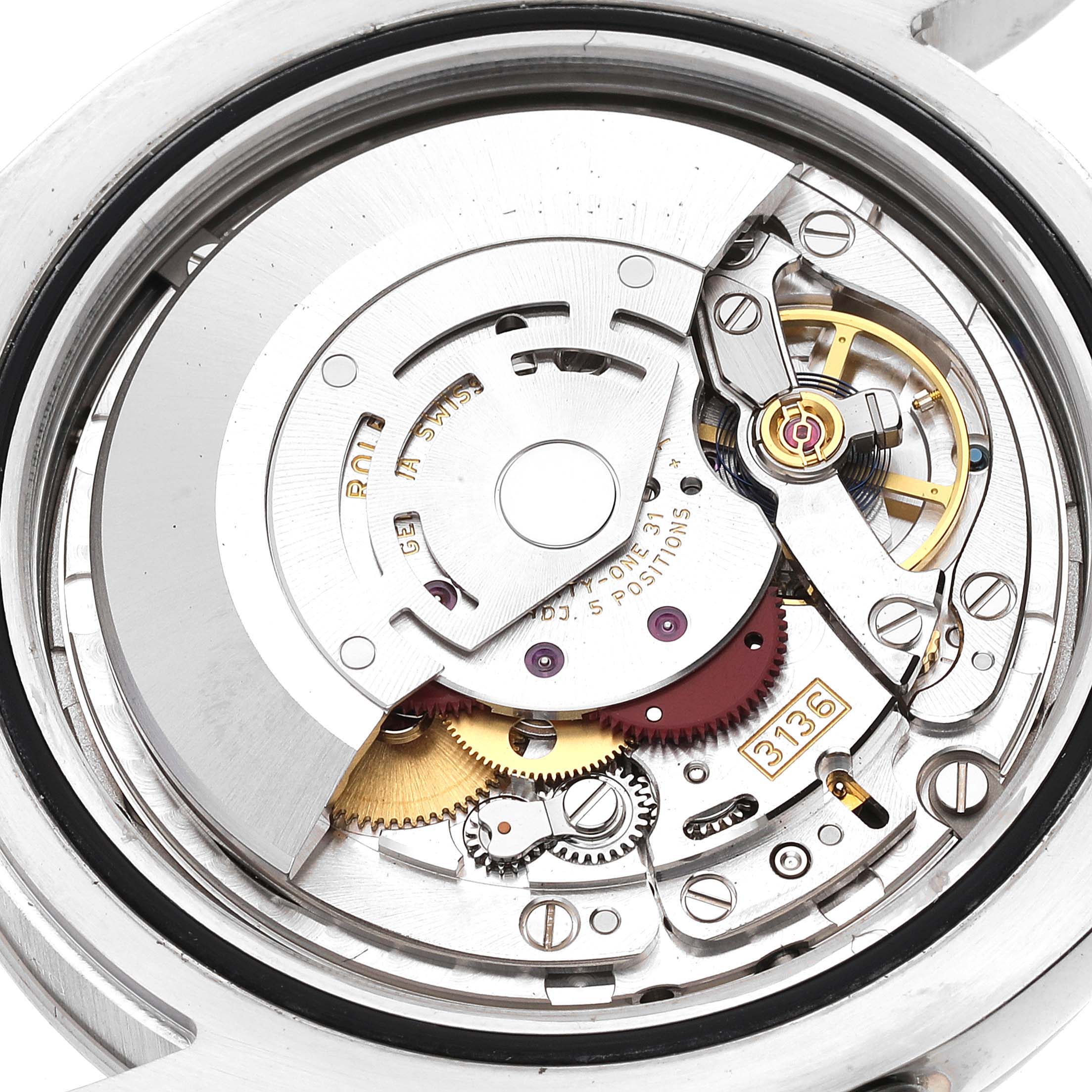 The image shows the internal mechanism of the Rolex Datejust 41 116334 Men's Stainless Steel Black Dial 116334 Men's Stainless Steel Black Dial, highlighting gears, rotors, and other intricate components from a close-up angle.