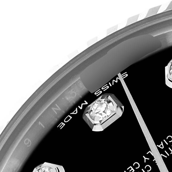 The image shows a close-up of the dial and bezel edge of a Rolex Mid-Size 178274 Women
s Stainless Steel Black Dial 178274 Women
s Stainless Steel Black Dial watch, highlighting the "Swiss Made" inscription and a diamond marker.