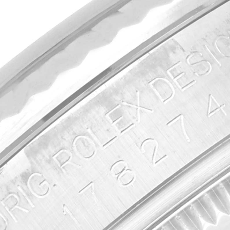 This close-up image shows the engraved outer rim and part of the bezel of a Rolex Mid-Size 178274 Women
s Stainless Steel Silver Dial 178274 Women
s Stainless Steel Silver Dial model watch.