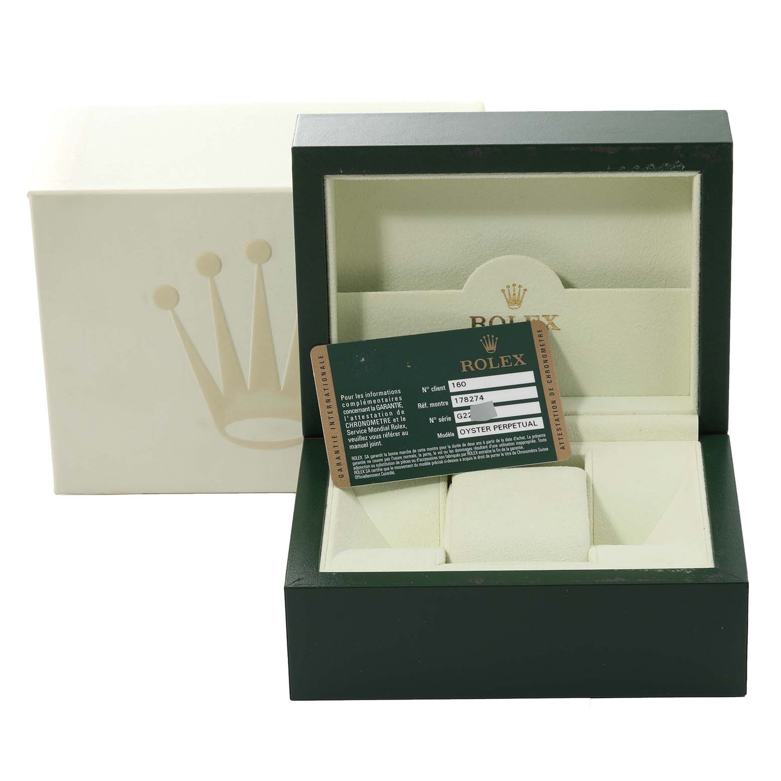 The image shows the opened green box for a Mid-Size Rolex watch with a warranty card inside.