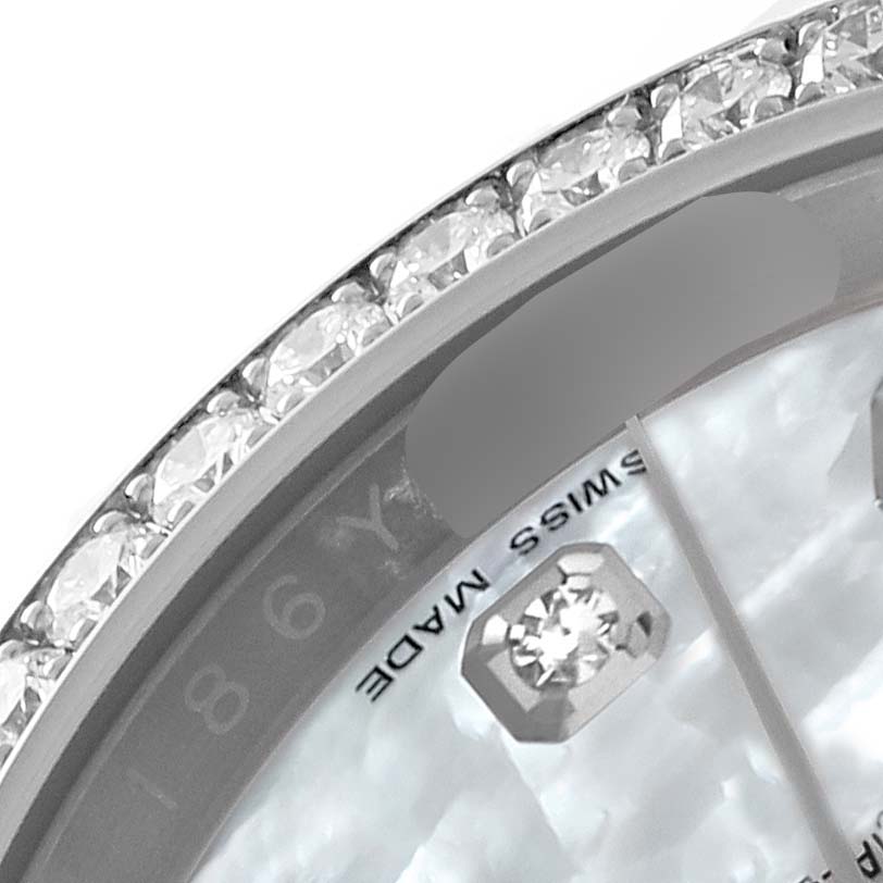 This close-up angle of the Rolex Datejust 116244 Men's Stainless Steel Mother of Pearl Dial 116244 Men's Stainless Steel Mother of Pearl Dial watch shows the diamond-set bezel and part of the dial with "SWISS MADE" text and diamond markers.