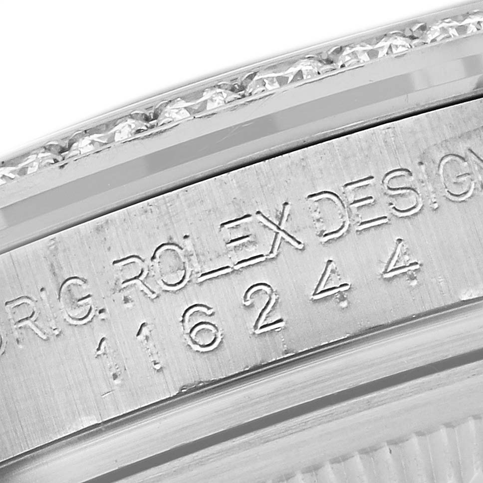 The image shows a close-up view of the engraved serial number on the case of a Rolex Datejust 116244 Men's Stainless Steel Mother of Pearl Dial 116244 Men's Stainless Steel Mother of Pearl Dial watch.