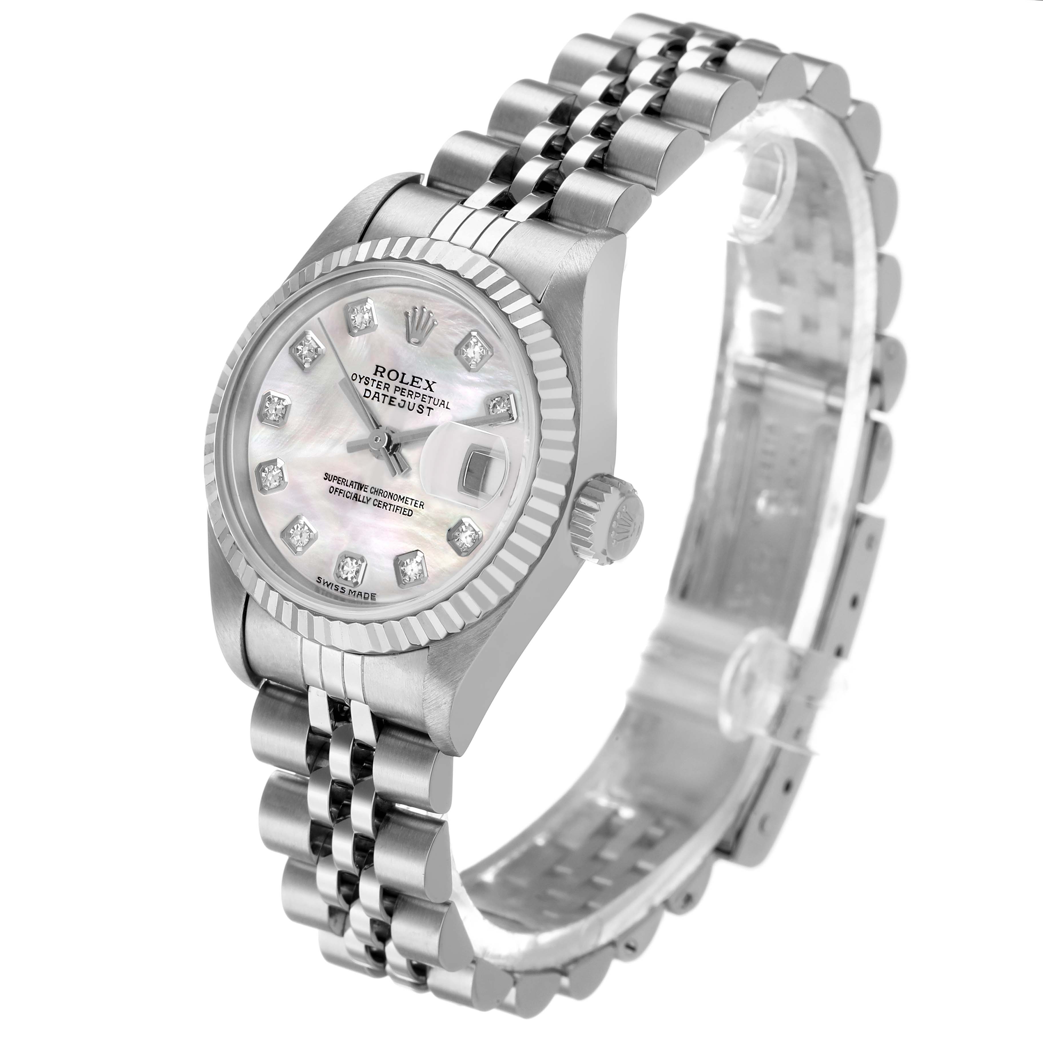 The Rolex Datejust 79174 Women's Stainless Steel Mother of Pearl Dial watch is shown from an angled view, highlighting its face, bezel, and bracelet.