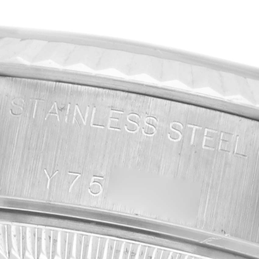 The image shows a close-up of the stainless steel case side and engraving on a Rolex Datejust 79174 Women
s Stainless Steel Pink Dial 79174 Women
s Stainless Steel Pink Dial.