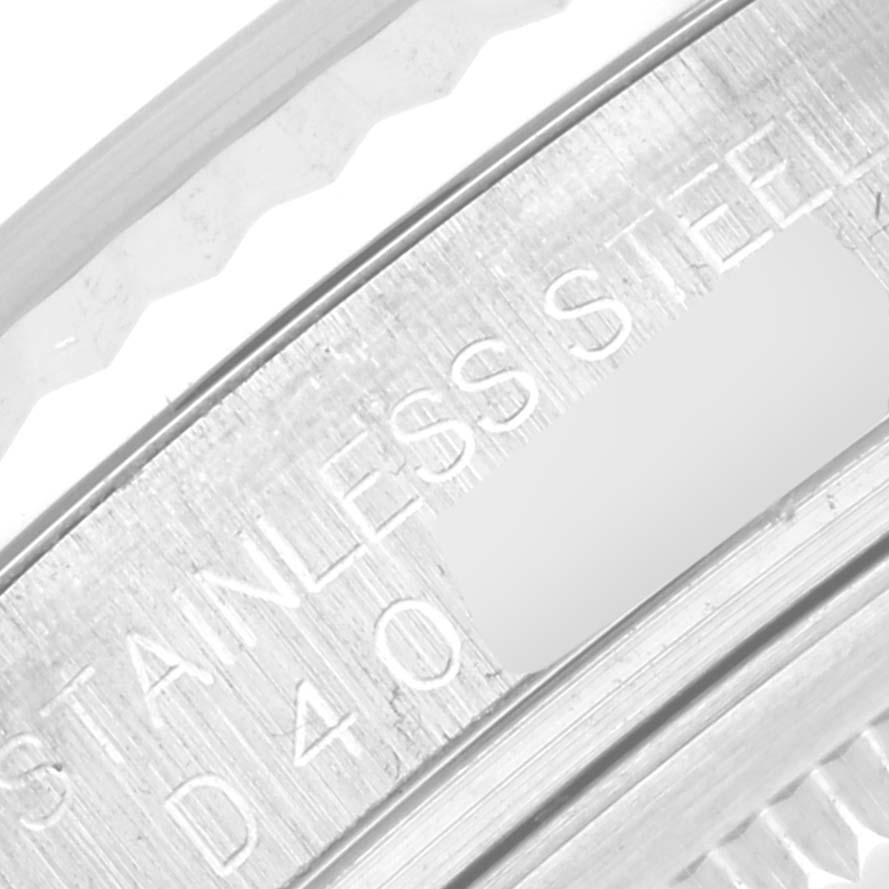 This is a close-up angle of the back case and inner bezel of a Rolex Datejust 116234 Men's Stainless Steel Pink Dial 116234 Men's Stainless Steel Pink Dial model displaying "STAINLESS STEEL".