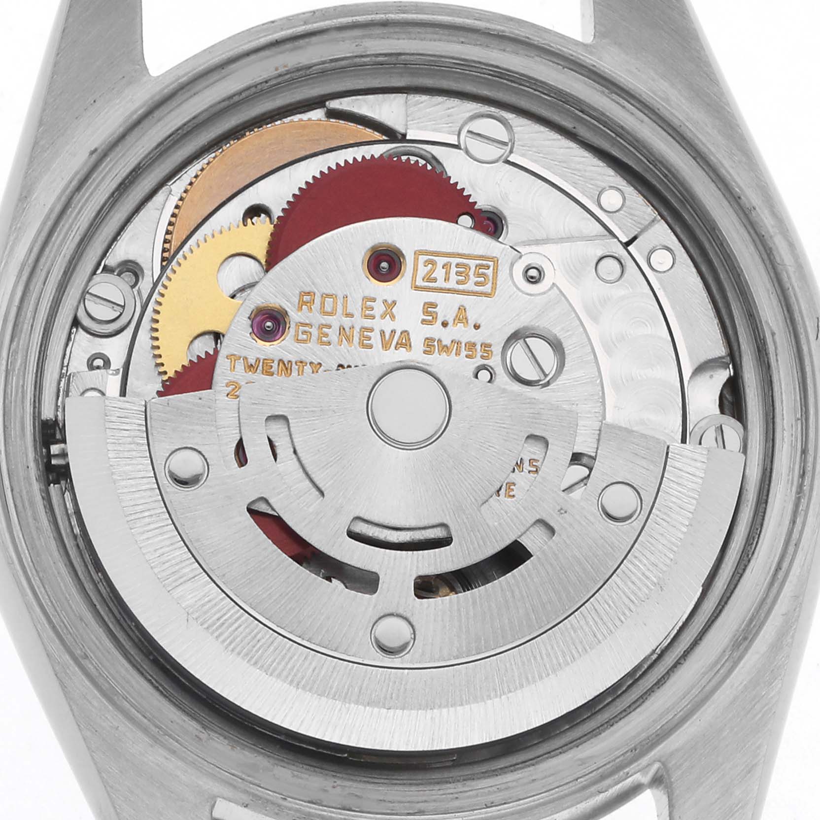 The image shows the back view of a Rolex Datejust 69174 Women
s Stainless Steel Silver Dial 69174 Women
s Stainless Steel Silver Dial watch, focusing on its intricate movement mechanism.