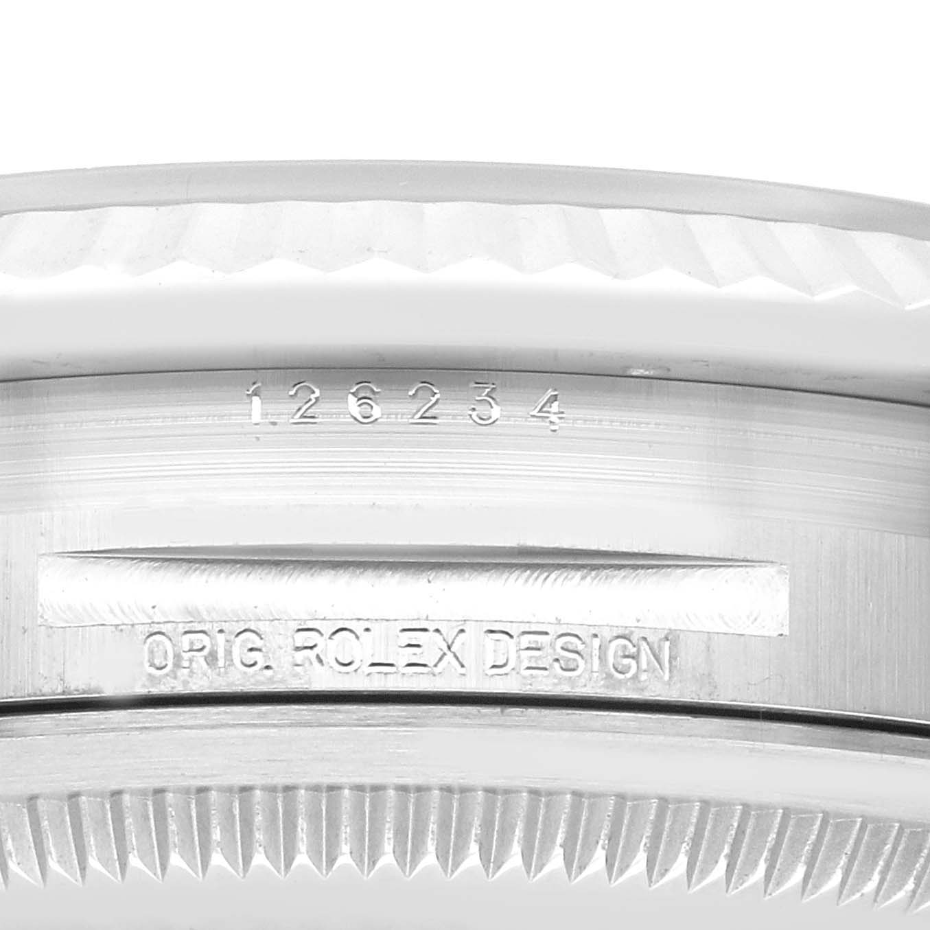 The image shows the side of the bezel and serial number engraving of a Rolex Datejust 126234 Men's Stainless Steel Silver Dial 126234 Men's Stainless Steel Silver Dial watch.