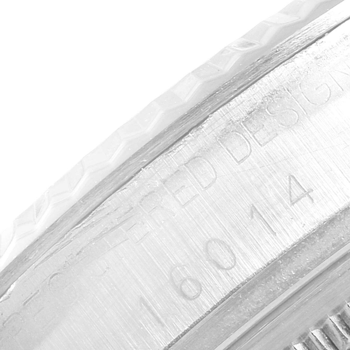 The image shows the close-up view of the side case with engraved text on a Rolex Vintage Collection 16014 Men's Stainless Steel Silver Dial 16014 Men's Stainless Steel Silver Dial model watch.