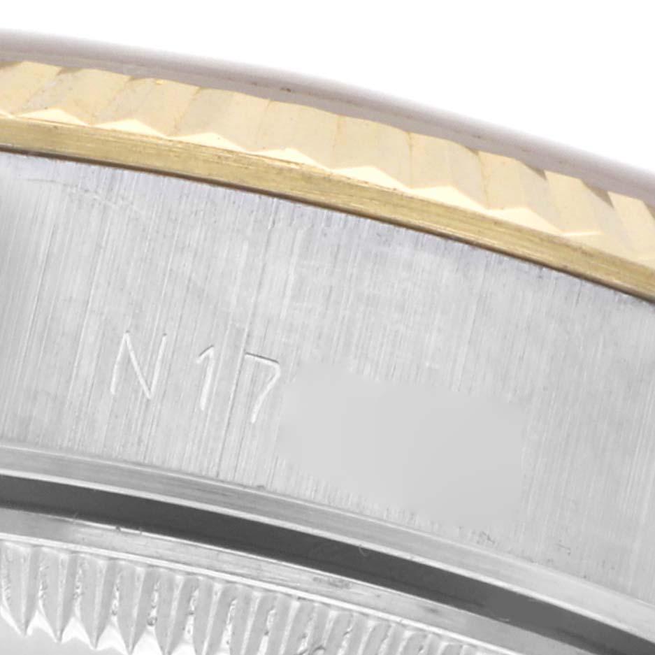 The image shows a close-up of the Rolex Datejust 69173 Women
s Steel and Gold (two tone) Champagne Dial 69173 Women
s Steel and Gold (two tone) Champagne Dial
s bezel and part of the case, highlighting the edge details.