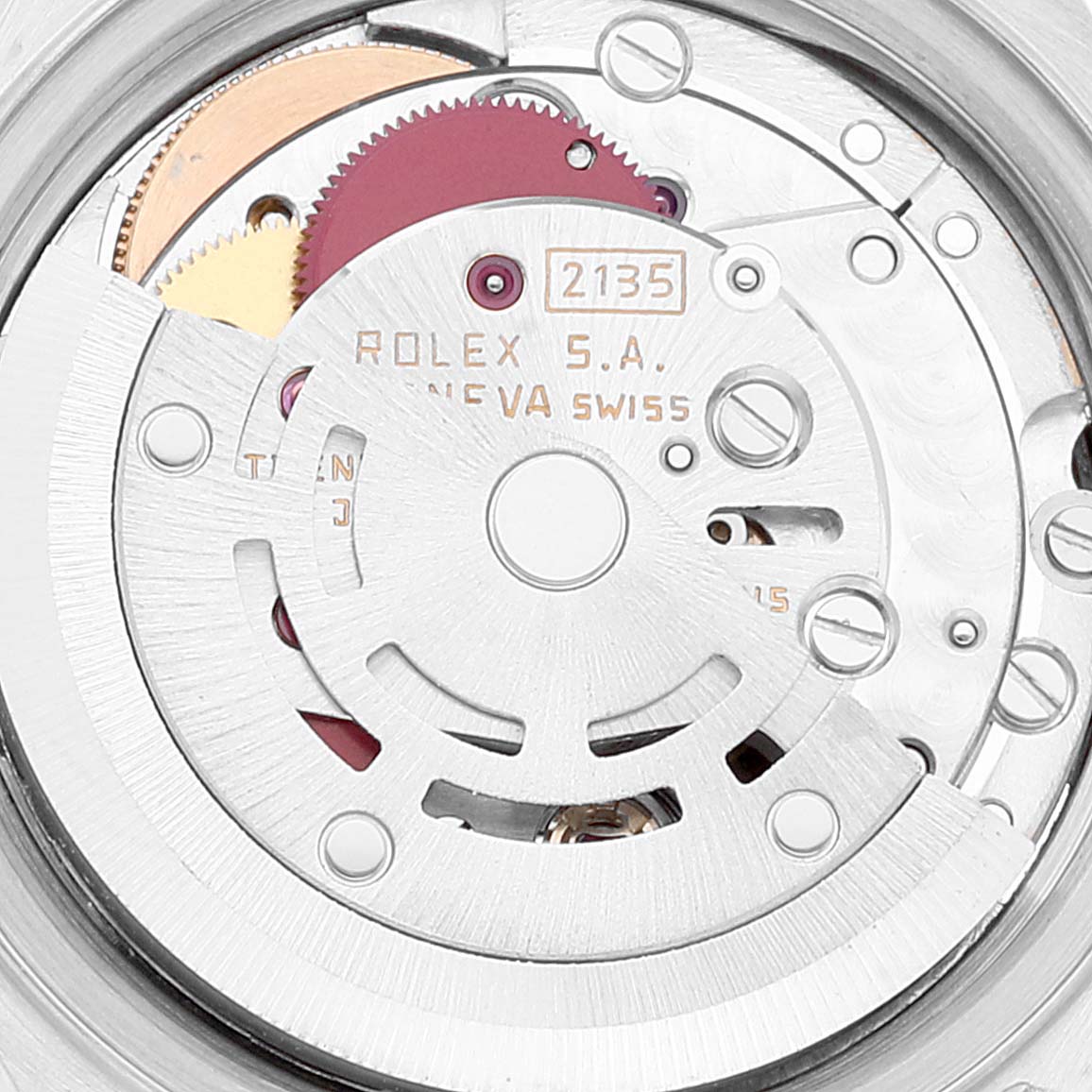 This close-up image shows the intricate movement mechanism of a Rolex Datejust 69173 Women's Steel and Gold (two tone) Beige Dial 69173 Women's Steel and Gold (two tone) Beige Dial watch, featuring gears and the rotor.