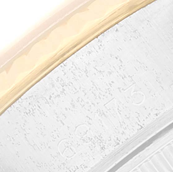 The image shows a macro view of the side of a Rolex Datejust 69173 Women's Steel and Gold (two tone) Beige Dial 69173 Women's Steel and Gold (two tone) Beige Dial watch bezel and part of the case.
