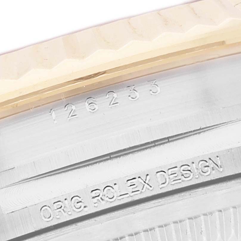This image shows a close-up of the bezel and case of a Rolex Datejust 126233 Men's Steel and Gold (two tone) Mother of Pearl Dial 126233 Men's Steel and Gold (two tone) Mother of Pearl Dial watch, highlighting the model number 126233.