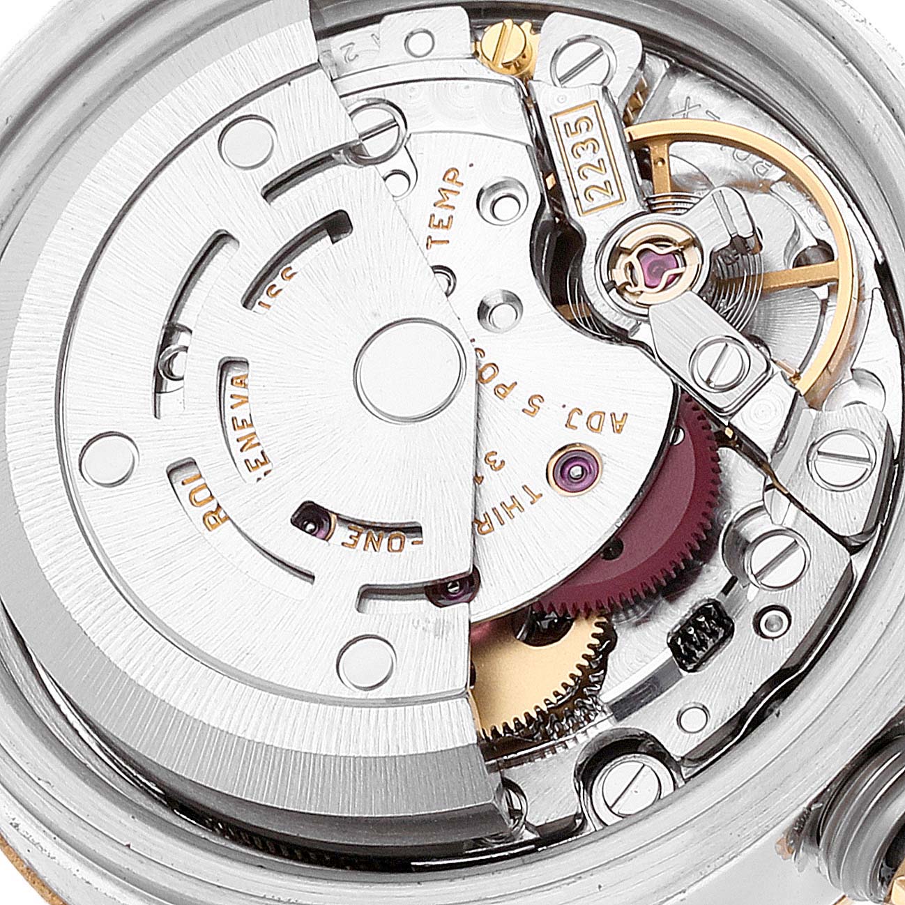 This image shows the intricate internal mechanism of a Rolex Datejust 179173 Women's Steel and Gold (two tone) White Dial 179173 Women's Steel and Gold (two tone) White Dial watch, including gears and the rotor.