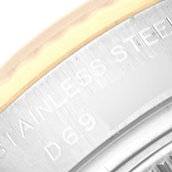 The image shows a close-up of the edge and part of the case back of a Rolex Datejust 179173 Women's Steel and Gold (two tone) White Dial 179173 Women's Steel and Gold (two tone) White Dial watch, highlighting the "STAINLESS STEEL" engraving.