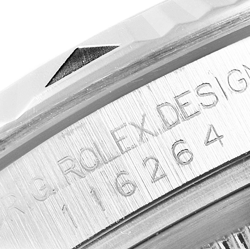 This image shows a close-up of the serial number and part of the bezel for a Rolex Turn-o-Graph 116264 Men
s Stainless Steel Black Dial 116264 Men
s Stainless Steel Black Dial model.