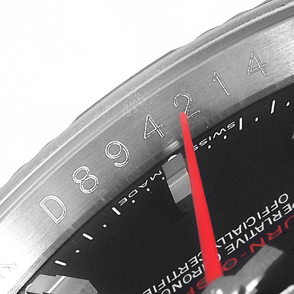 This close-up shot displays the engraved serial number and part of the dial of the Rolex Turn-o-Graph 116264 Men
s Stainless Steel Black Dial 116264 Men
s Stainless Steel Black Dial model.