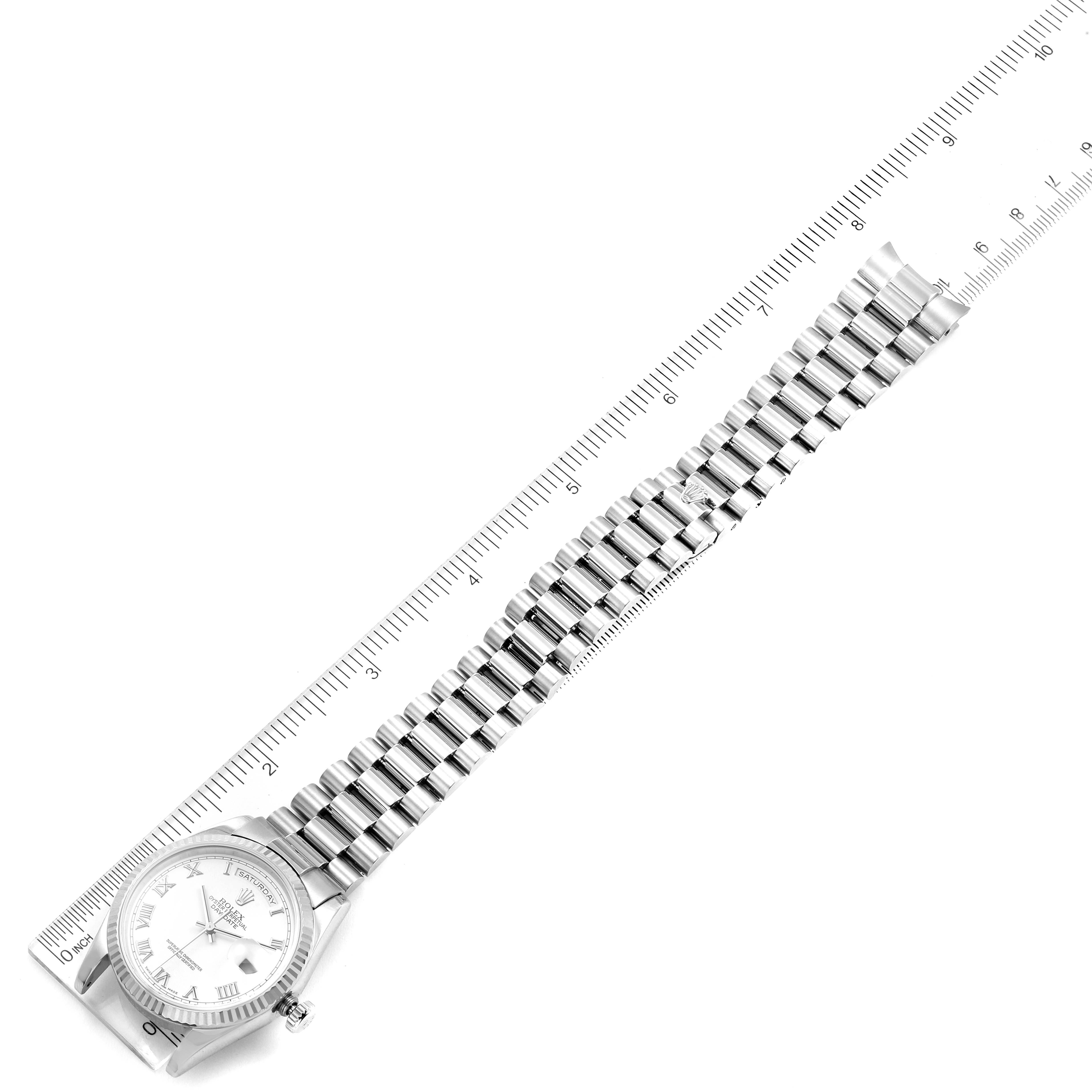 The image shows a Rolex President 118239 Men's White Gold White Dial 118239 Men's White Gold White Dial model watch laid alongside a ruler, displaying the watch face and full bracelet.