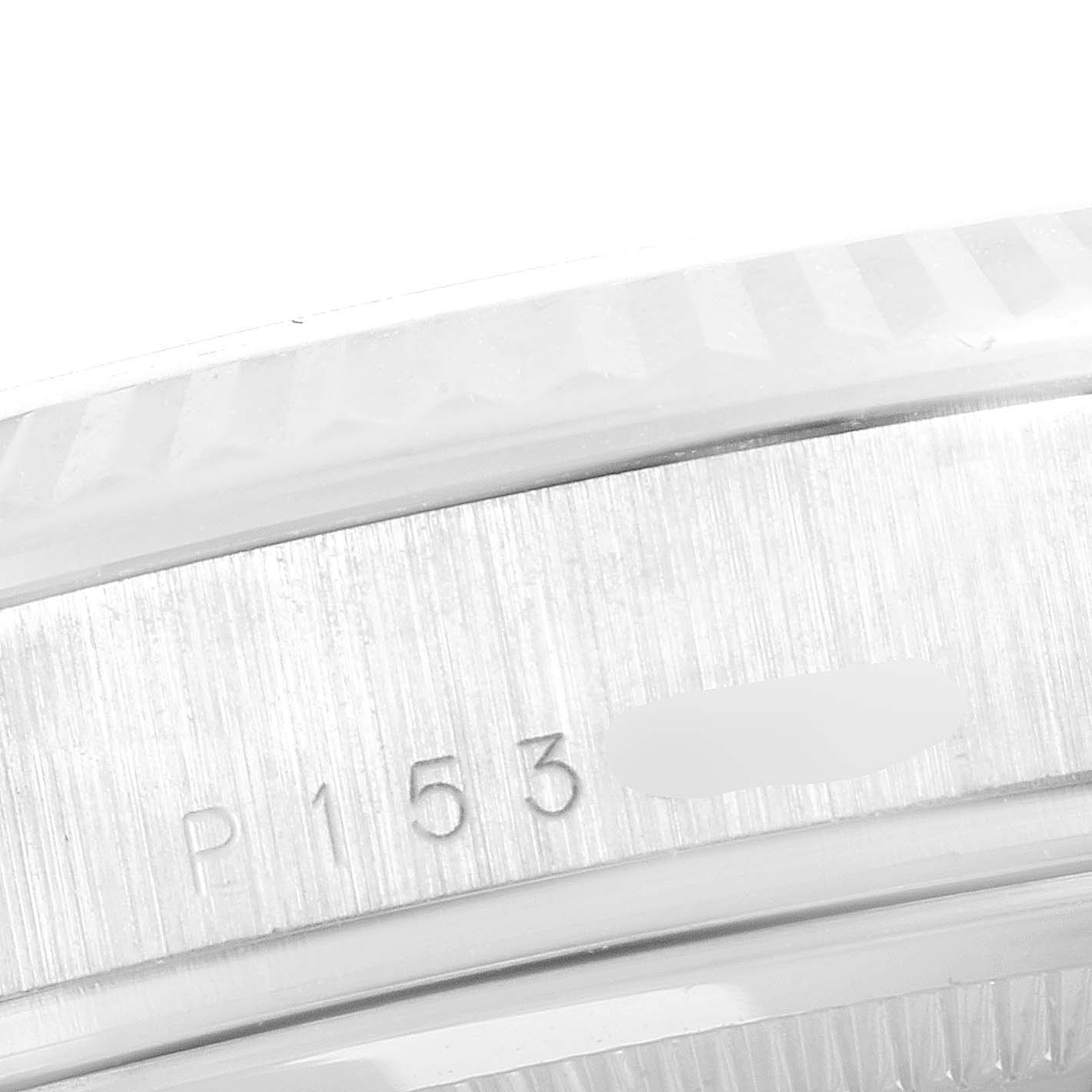 The image shows a close-up of the serial number engraved on the case of a Rolex President 118239 Men's White Gold White Dial 118239 Men's White Gold White Dial model watch.