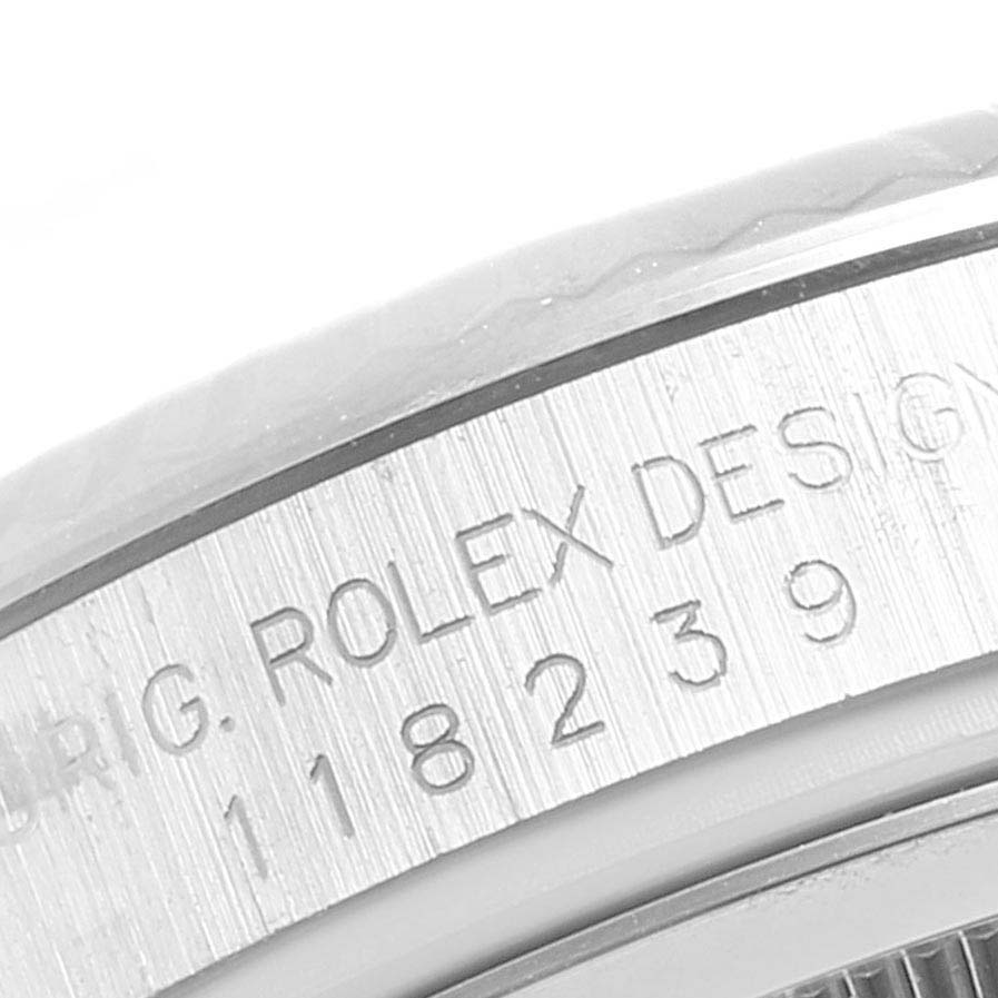 The image shows an angled close-up view of the engraved side of a Rolex President 118239 Men's White Gold White Dial 118239 Men's White Gold White Dial model watch.