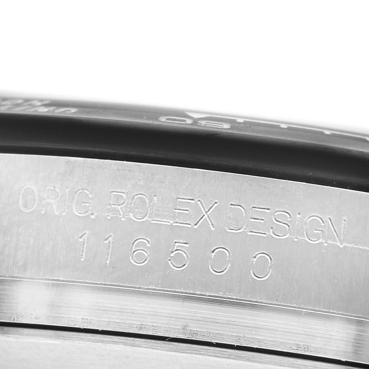 The image shows a close-up of the edge of the bezel with "Orig. Rolex Design 116500" on a Rolex Daytona 116500LN Men's Stainless Steel White Dial.