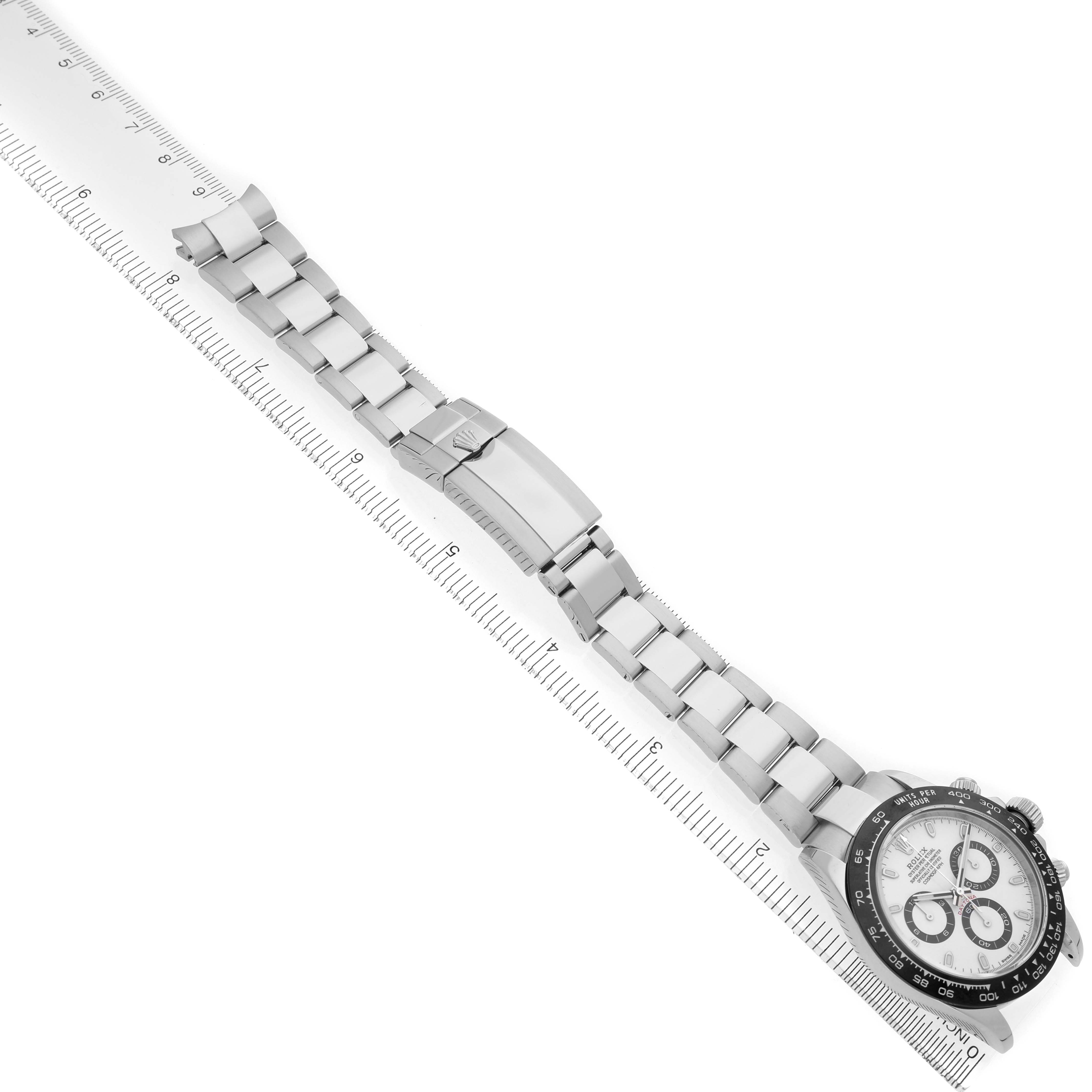 The Rolex Daytona 116500LN Men's Stainless Steel White Dial watch is shown at an angle, featuring the bracelet, clasp, and full watch face with a visible tachymetric scale.