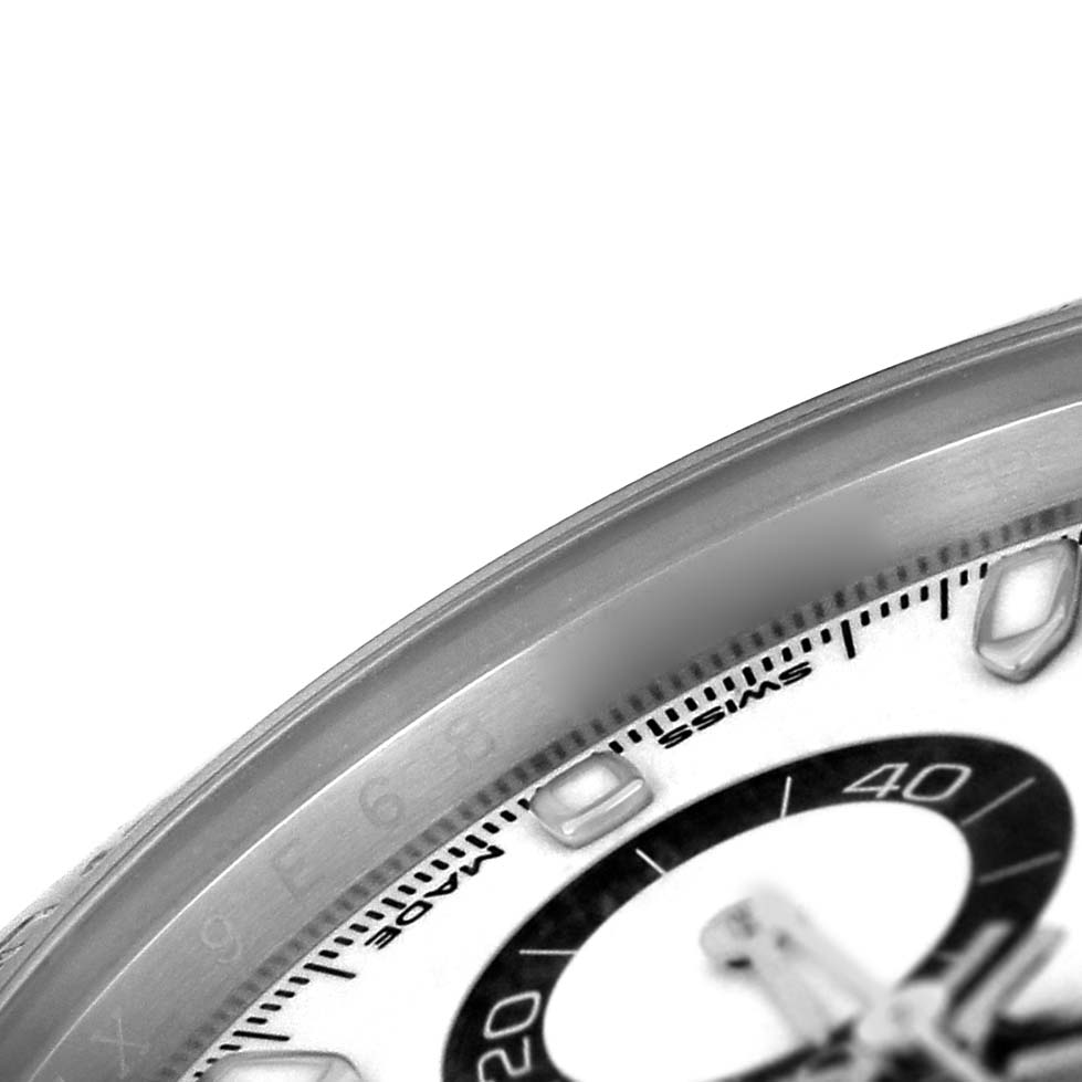 The image shows a close-up angle of the bezel and part of the sub-dial of a Rolex Daytona 116500LN Men's Stainless Steel White Dial watch.