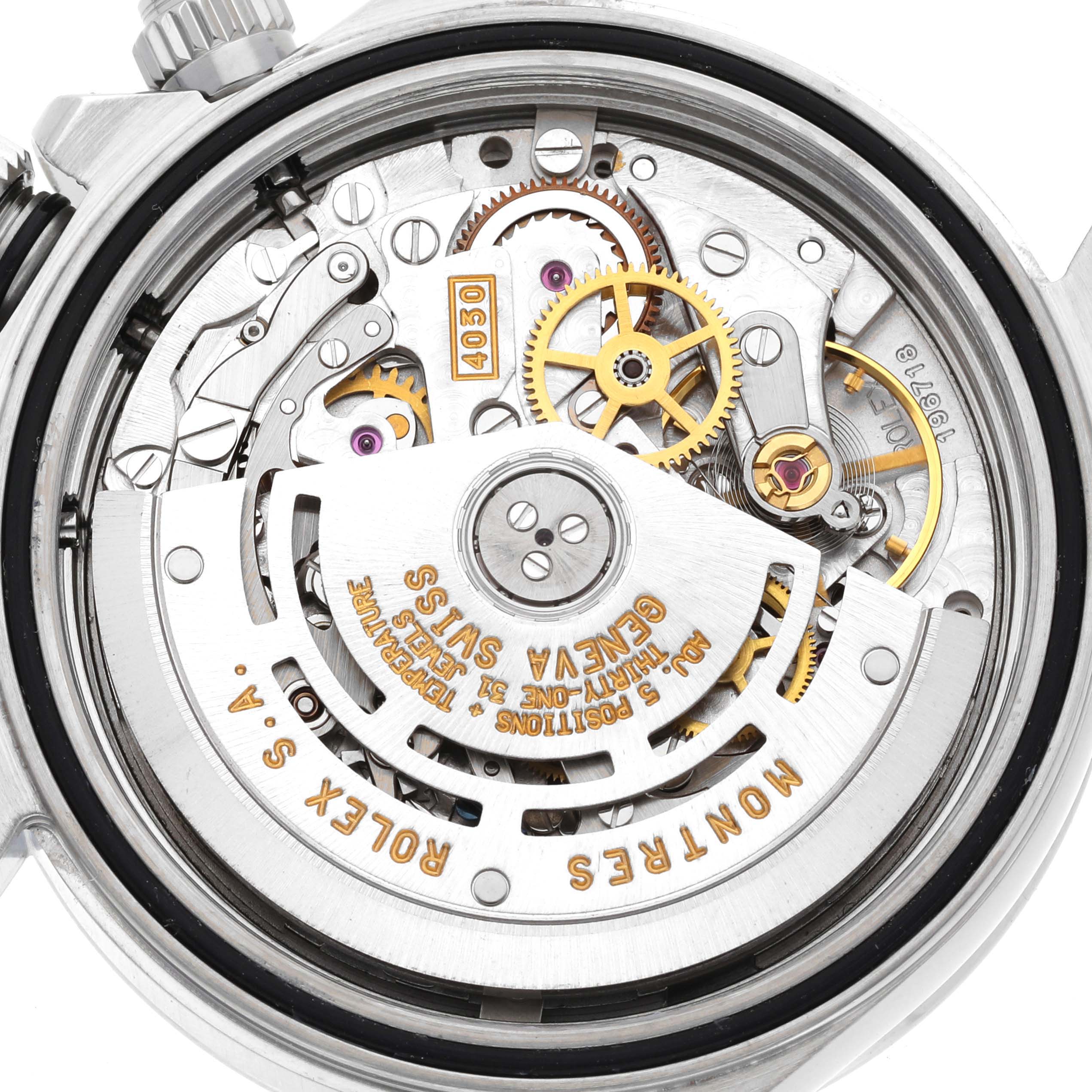 The image shows the inner mechanical movement of a Rolex Daytona 16520 Men's Stainless Steel White Dial 16520 Men's Stainless Steel White Dial watch, specifically highlighting its gears and rotor mechanism.