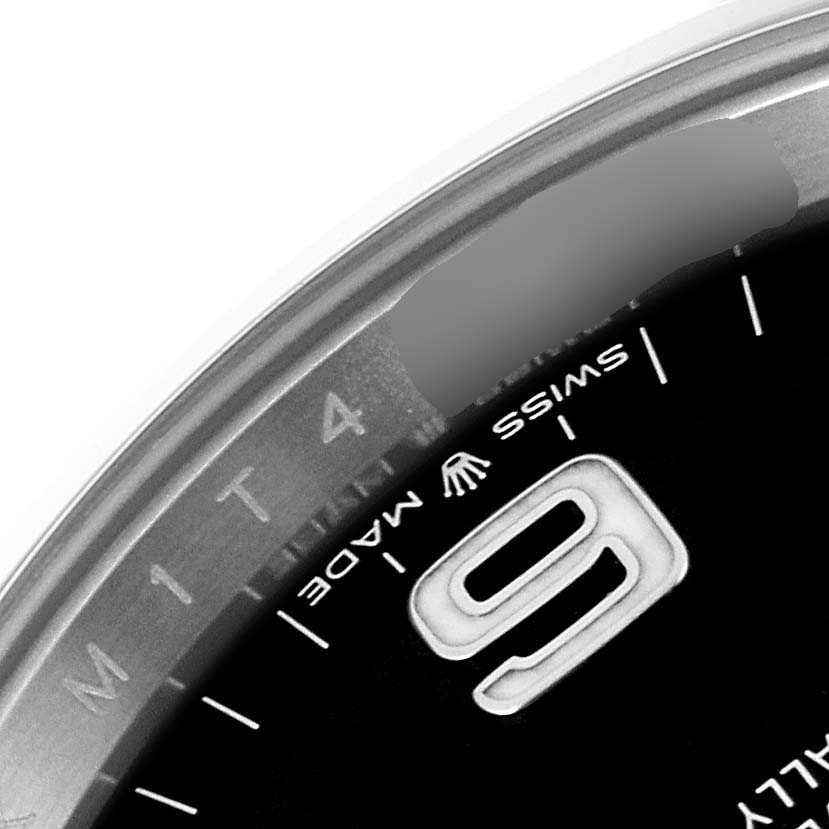 This close-up image shows part of the dial and bezel of a Rolex Explorer 124270 Men
s Stainless Steel Black Dial 124270 Men
s Stainless Steel Black Dial watch, indicating the "Swiss Made" marking and the numeral "9".