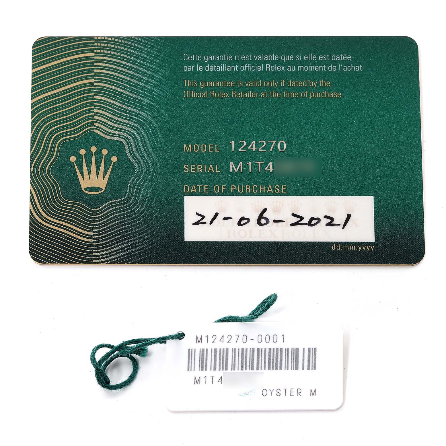 The image shows the guarantee card and hang tag for the Rolex Explorer 124270 Men
s Stainless Steel Black Dial 124270 Men
s Stainless Steel Black Dial model 124270.