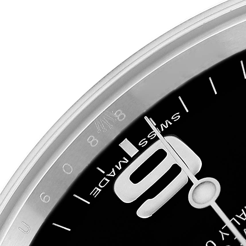 The image shows a close-up of the dial and bezel of the Rolex Explorer 214270 Men
s Stainless Steel Black Dial 214270 Men
s Stainless Steel Black Dial model, highlighting the "9" hour marker and minute hand.