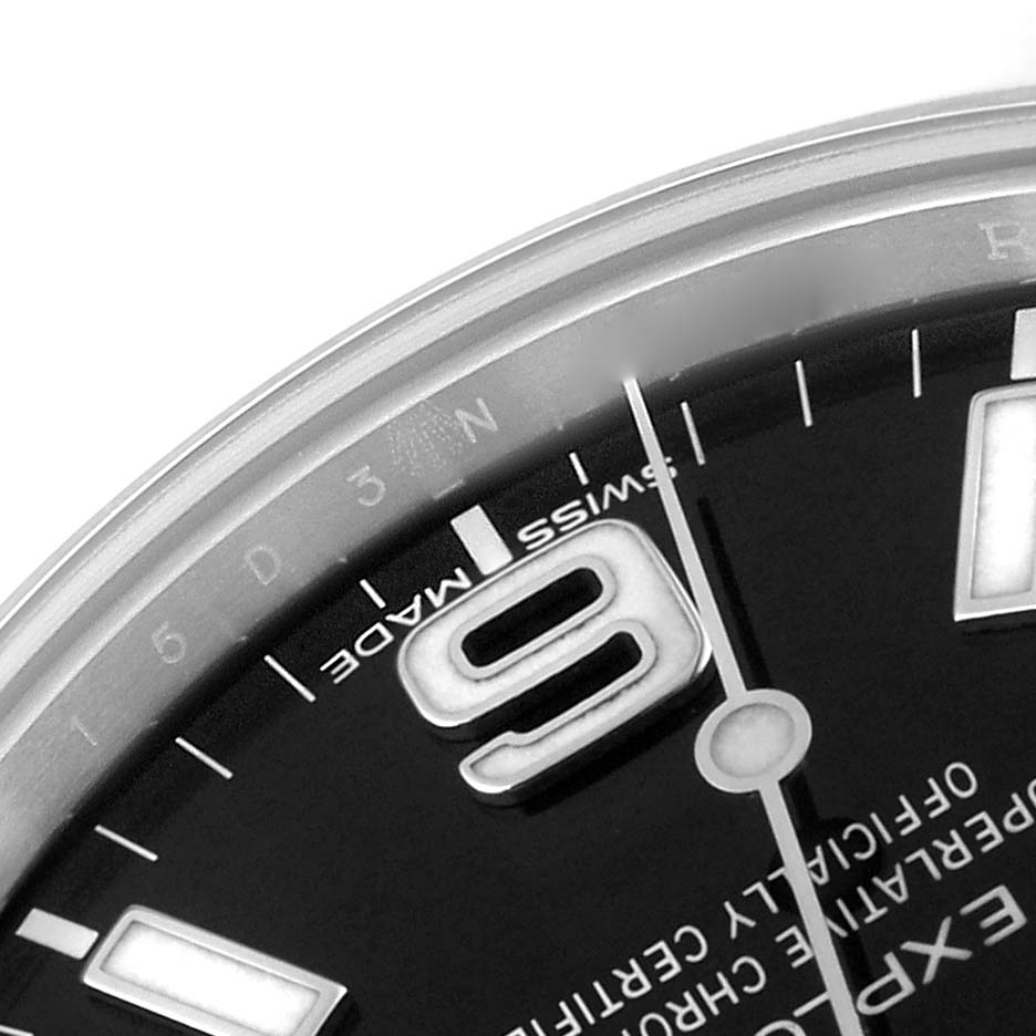 This close-up image shows a section of the dial and bezel of a Rolex Explorer 214270 Men
s Stainless Steel Black Dial 214270 Men
s Stainless Steel Black Dial watch, highlighting the number 9 and surrounding details.