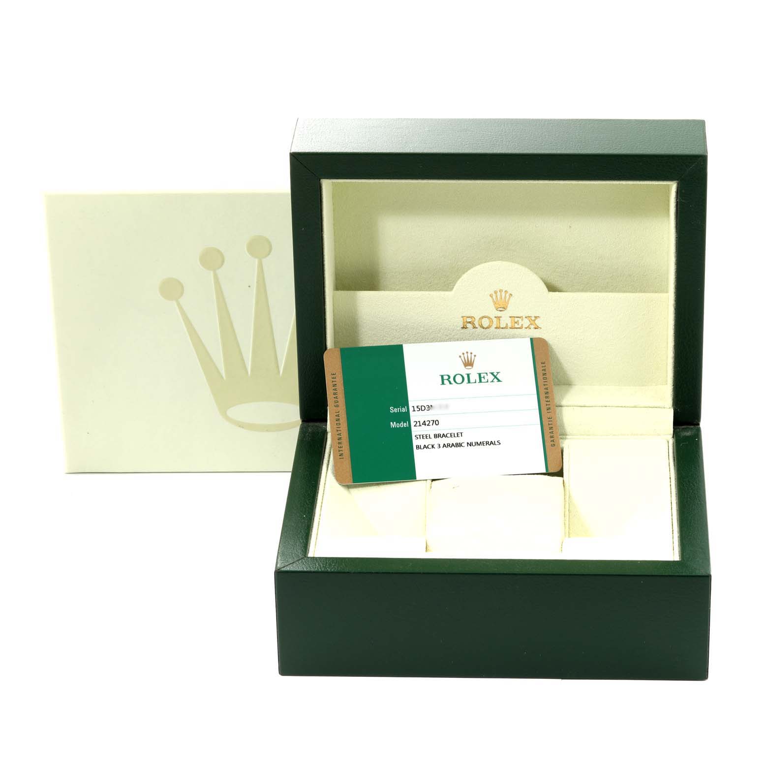 The image shows a Rolex Explorer 214270 Men
s Stainless Steel Black Dial 214270 Men
s Stainless Steel Black Dial model watch case with an open lid, displaying the guarantee card inside.