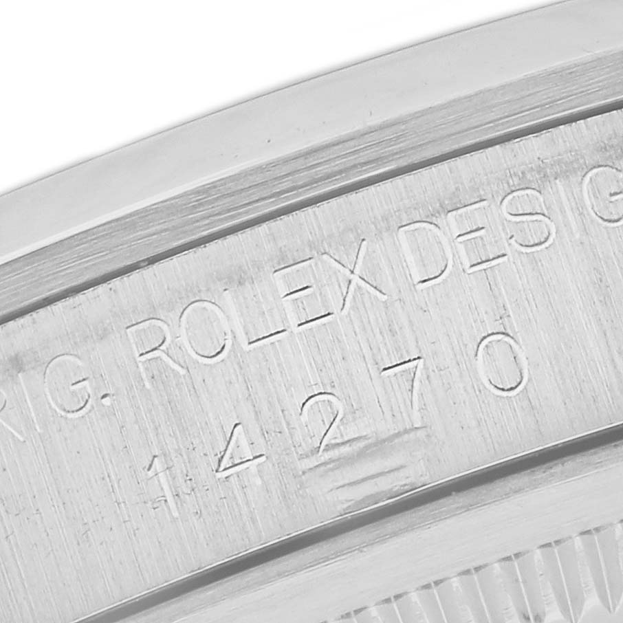 This image shows a close-up of the engraved serial number and text on the case back of a Rolex Explorer 14270 Men
s Stainless Steel Black Dial 14270 Men
s Stainless Steel Black Dial watch.