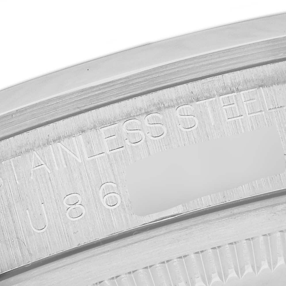 This is a close-up of the case back of a Rolex Explorer 14270 Men
s Stainless Steel Black Dial 14270 Men
s Stainless Steel Black Dial model, showing the stainless steel engraving and partial serial number.