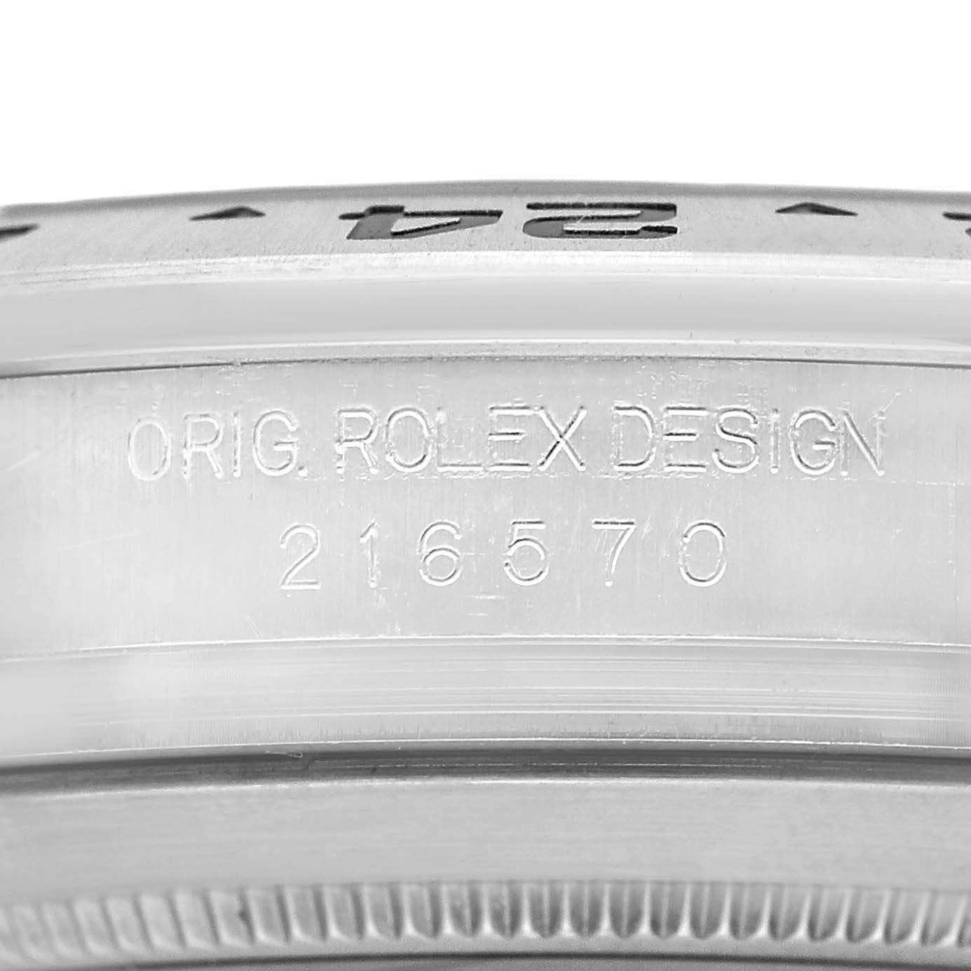 The image shows the side view of a Rolex Explorer 216570 Men's Stainless Steel White Dial model focusing on the engraved serial and model numbers.