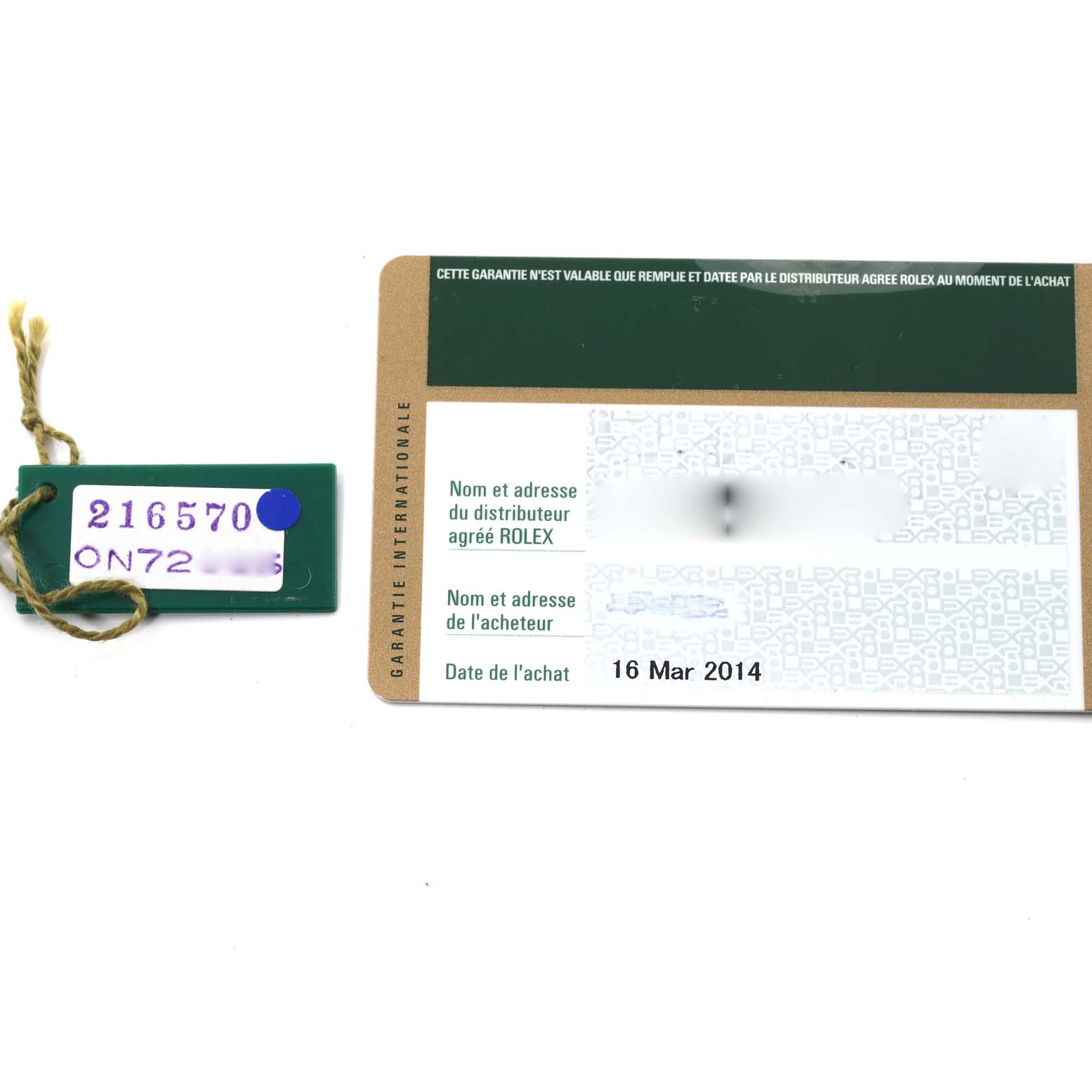 This image shows a green Rolex Explorer 216570 Men's Stainless Steel Black Dial 216570 Men's Stainless Steel Black Dial model tag and an international warranty card dated March 16, 2014.