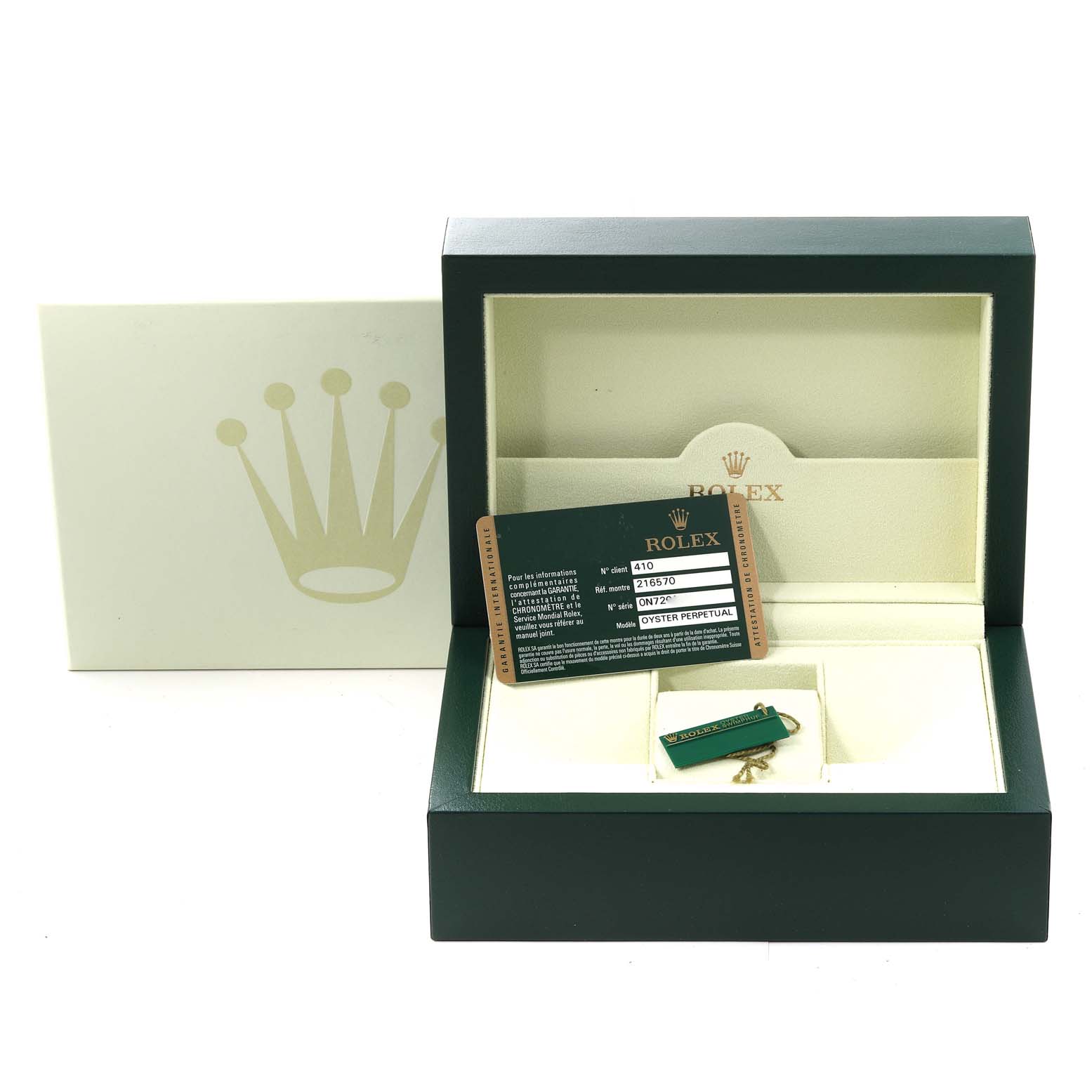 The image shows a Rolex Explorer 216570 Men's Stainless Steel Black Dial 216570 Men's Stainless Steel Black Dial watch box and accessories, including a warranty card and a hang tag, viewed from the front.