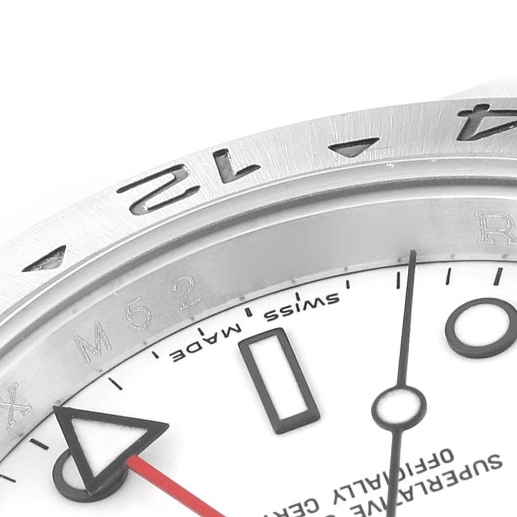 The image shows a close-up angle of the bezel, dial, and hands of a Rolex Explorer 16570 Men's Stainless Steel White Dial 16570 Men's Stainless Steel White Dial watch.